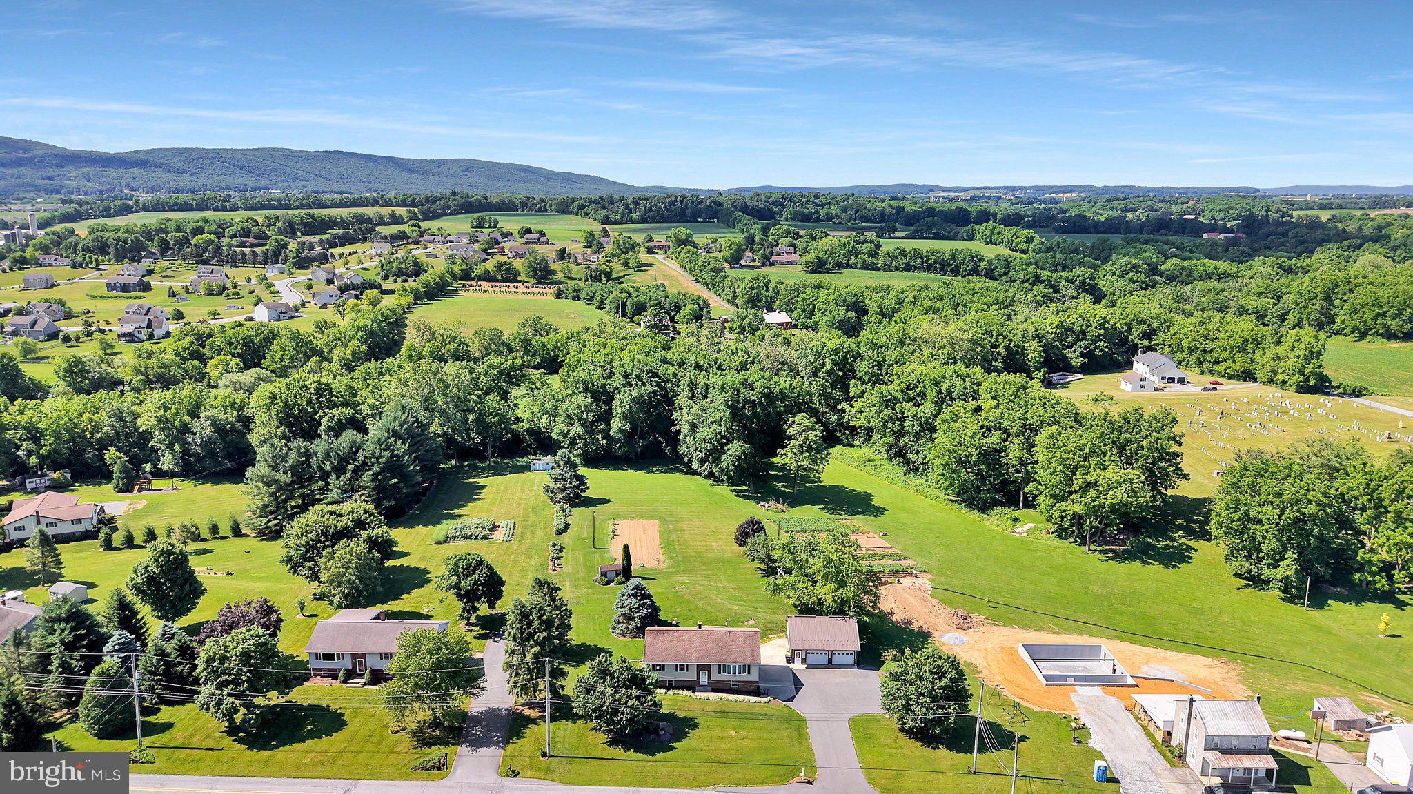 Public Auction Thursday, July 30, 2026 @ 5 PM - Open House Saturdays July 11 & July 18 from 1-3 PM - Buyer required a 10% non refundable deposit, settlement within 45 days. Buyer pays the 2% RE transfer tax - List price does not reflect the final sales price * Womelsdorf/Myerstown Area country 1,404 SF split foyer on 1.44 acres. Featuring an open eat in kitchen & living room, large pantry, laundry room, 3 bedrooms, bath, 14x14 deck off the kitchen. Lower level is partially finished with a family room, bedroom w/exterior entrance, full bath, canning room. Attached 2 car garage in basement. Central air. 26x30 1 1/2 story steel detached garage/shop w/2 overhead doors, garden shed. A rural location between Myerstown & Womelsdorf with a desirable 1.44 acre mostly level lot. A newer detached garage/shop ideal for woodworking, car storage, etc...