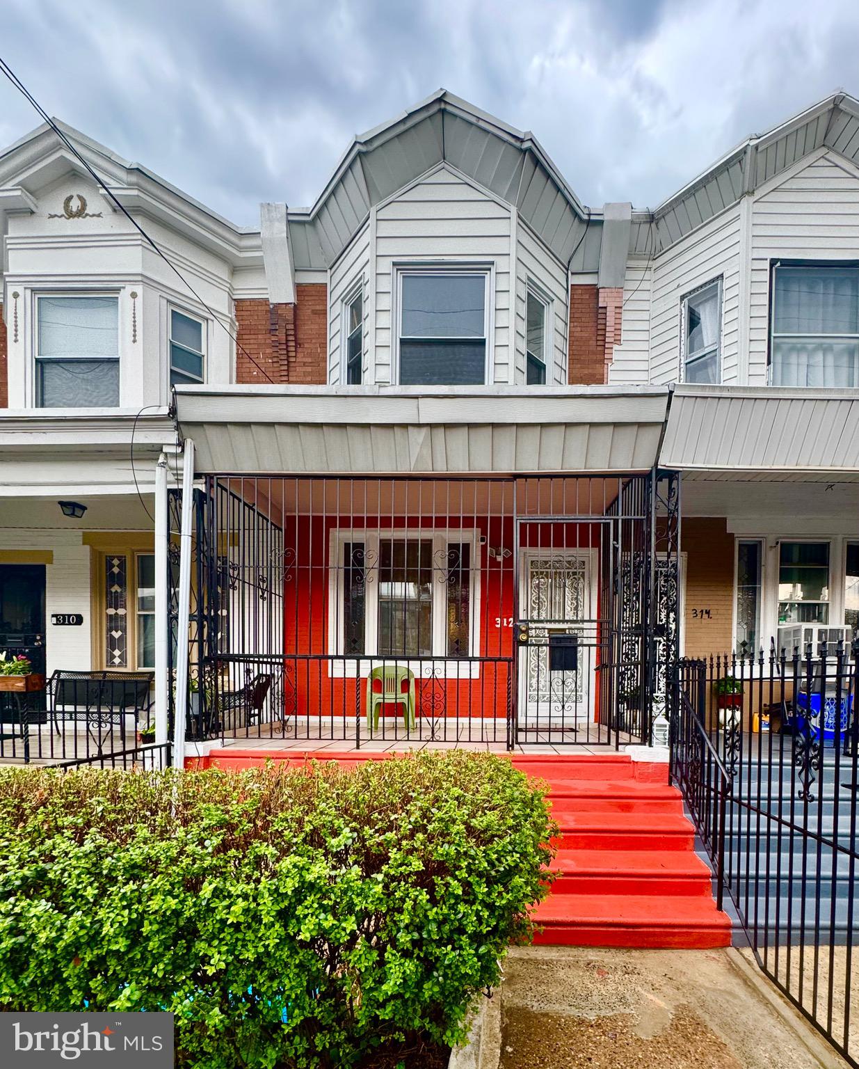 Classic Olney row home offering solid bones and serious upside. This 3-story brick townhouse features a covered front porch, spacious living and dining areas with newer LVP flooring throughout, and a full eat-in kitchen with oak cabinetry, followed by an exit to the rear. Upstairs you’ll find 3 generously sized bedrooms including a bright front bay windowed main suite, plus 2 more spacious bedrooms. A fully tiled bath completes the upstairs. The basement is complimented by its own full bathroom and has access directly to the rear yard
