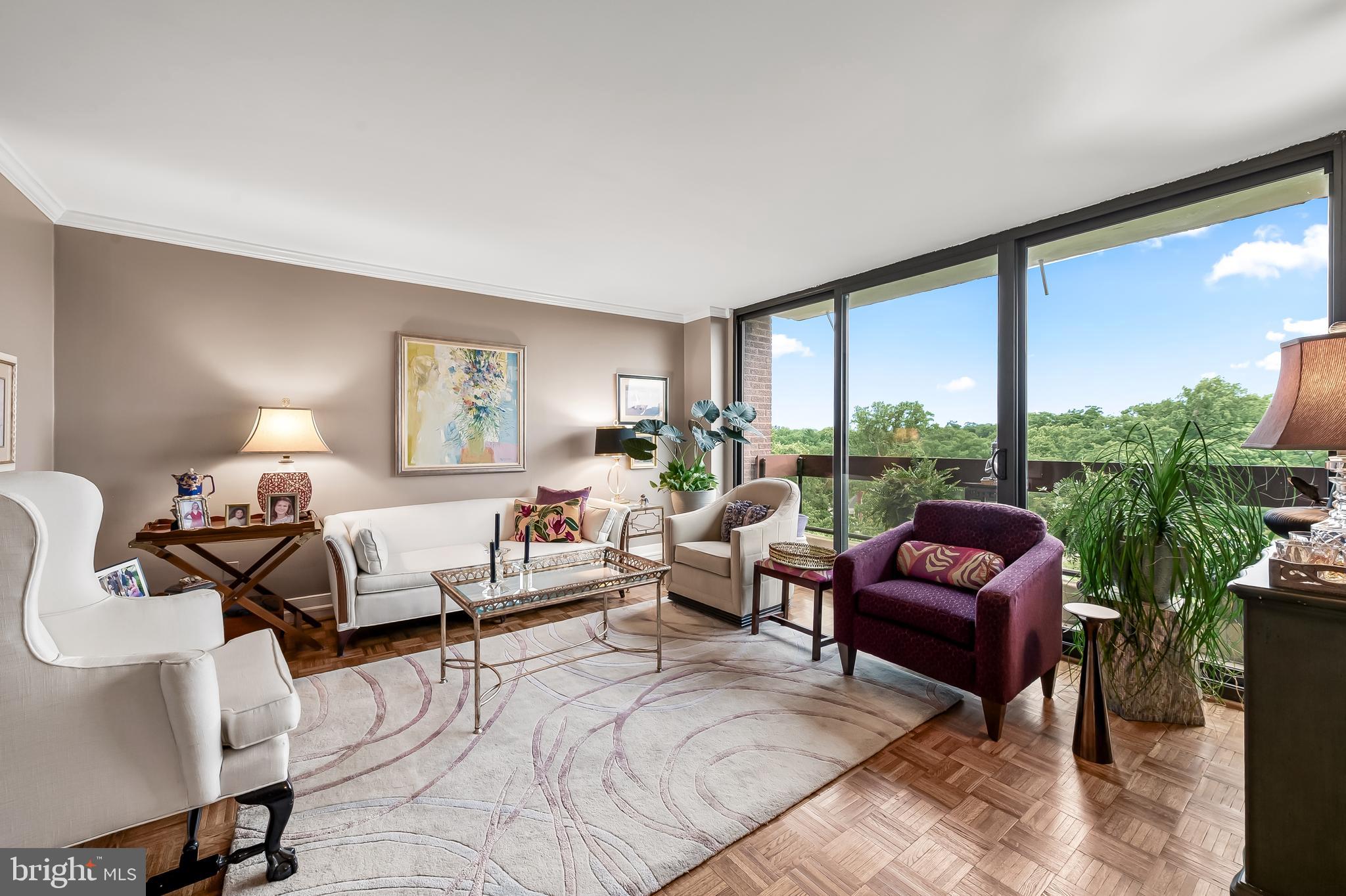 Ready to simplify your life? Fall in love with this gorgeous, renovated ninth floor end unit condo in the Winthrop House at 4100 North Charles Street in Guilford. Just steps from Hopkins University and near Union Memorial Hospital. Enjoy the views in all seasons, especially in the Fall with the full array of leaf hues creating a picture perfect landscape view from your balcony. This large condo offers two bedrooms and two full baths, and recently drywalled ceilings (the asbestos pop-corn ceiling has been removed!), a wonderful, updated, and large kitchen with ceramic tiled back splash and custom lighting and a breakfast bar, as well as updated baths. Refinished parquet flooring is enhanced by replacement windows and sliding doors and custom window treatments. So much space and storage! The large wall featuring built-in shelves in the hallway to the bedrooms creates the perfect location for displaying artwork, books, or your favorite ceramics. The primary bedroom is large enough for a king-sized bed and has a wall of built-ins plus a desk nook perfect for the laptop with windows on two sides. Your walk-in closet has been redesigned for maximum hanging space plus there is a make-up corner in which a small table easily fits. The primary bath is updated with a large shower. The second bedroom is used as a den with a pull-out sofa. And the hall bath is also updated with a large shower. Winthrop House is one of the most popular buildings in the Hopkins area, and boasts many amenities. The entry lobby is staffed, and other amenities include an inground pool, a fitness center, a game/community room, a sauna, and parking. Unit 908 includes one parking spot in the garage. Fees include heat, water, air conditioning, and electric.