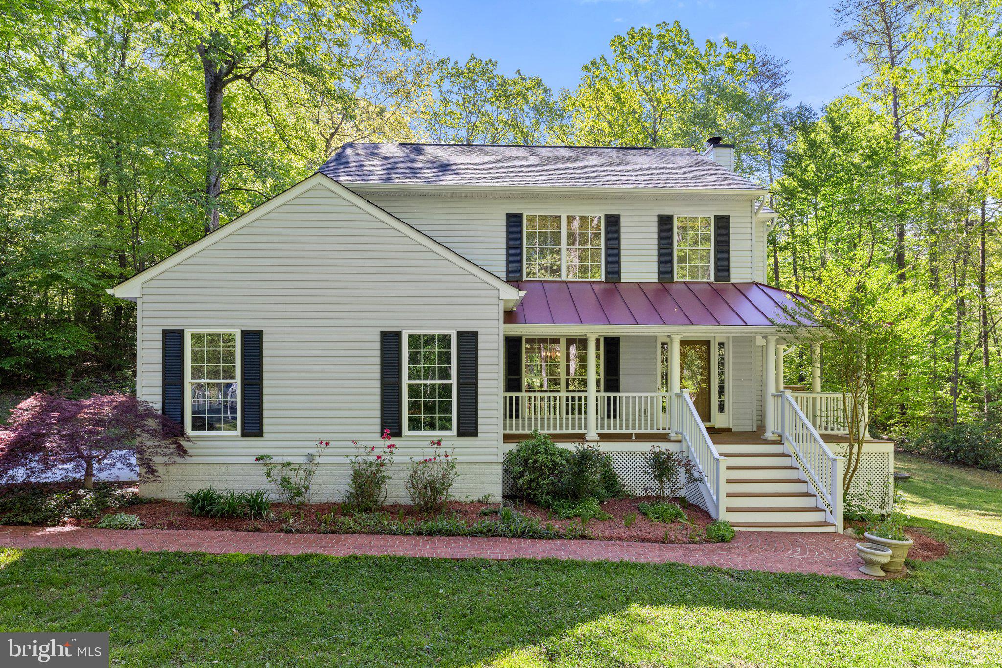 Nature Lovers Paradise! Charming 5-Bedroom Home on 4+ Acres with Private Stream & Hiking Trail

Nestled in a peaceful cul-de-sac, this spacious 5-bedroom, 3-bathroom home offers over 4 acres of privacy with a private stream and hiking trail. Enjoy the outdoors with a large wrap-around deck, hot tub, and beautiful wooded views.

The gourmet kitchen is equipped with quartz counters, recent appliances (2024 fridge, stove, and microwave; 2022 dishwasher), soft-close drawers, pull-out shelving, and a custom wine rack. The family room features vaulted ceilings, a fireplace, and skylights, with sliding doors to the deck.

Upstairs, the primary suite boasts a soaking tub, frameless shower, and private water closet. Three additional bedrooms share a spacious hall bath. Hardwood floors run throughout the main and upper levels.

The walk-out lower level includes a rec room with a hidden motorized movie screen, a full bath, and a flexible bedroom/den with French pocket doors.

With a newer metal roof (2020), updated features, and located just minutes from shopping along the 95 corridor, this home offers the perfect blend of privacy and convenience. Don’t miss out on this rare find