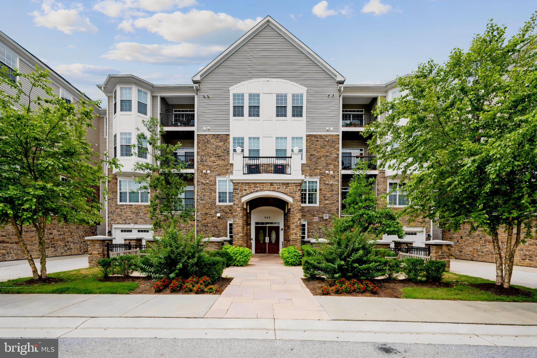 Welcome to easy, maintenance-free living in the highly sought-after 55+ community of The Gatherings at Quarry Place! Located on the third floor, this beautifully maintained 2-bedroom, 2-bath condo with a detached garage offers the perfect combination of comfort, style, and an active lifestyle.This home is just right for someone who welcomes privacy, the convenience of low maintenance, character, peace of mind, and the feeling of being tucked away. Outdoors, enjoy a leisurely walk around the Quarry; sitting in the gazebo watching nature, checking out the pool/fitness center and meeting up with neighbors.
Step inside to find gleaming luxury vinyl plank flooring, an open and inviting floor plan, granite countertops, stainless steel appliances, and a spacious living and dining area that flows seamlessly to a private balcony. Every detail reflects the pride of ownership throughout this immaculate home.

The generous primary suite is a true retreat, featuring a cozy sitting area with a bay window, two large walk-in closets, and an oversized en-suite bath with a double vanity, linen closet, and plenty of room to start and end your day in comfort. The second bedroom is bright and spacious with large windows, while the second full bath is beautifully appointed with tasteful finishes. A conveniently located laundry room, a new hot water heater, fresh paint and professionally cleaned carpets add to the home’s appeal.

Life at The Gatherings at Quarry Place is about so much more than the home itself. Enjoy a vibrant, active community with a beautifully appointed clubhouse, fitness center, outdoor pool, gathering spaces, and a welcoming lobby where neighbors become friends. Whether you’re joining community events, relaxing by the pool, or meeting friends at the clubhouse, you’ll love the social atmosphere this community offers. If you are looking for easy living, elevator access, and the simplicity of lock-and-leave when you want as well as easy access to everything you need, then you must consider and visit -

UNIT 308 - ‘A Great Place to Call Home!’
Conveniently located just minutes from I-795, Route 140, shopping, dining, and everything Reisterstown and Westminster have to offer, this exceptional condo combines low-maintenance living with an unbeatable location. Complete with the convenience of a private detached garage for parking and additional storage, this home truly has it all.

Don’t miss your opportunity to enjoy the carefree lifestyle you’ve been waiting for! *both bedroom carpets have been stretched and professionallcy cleaned since 3D tour was completed*