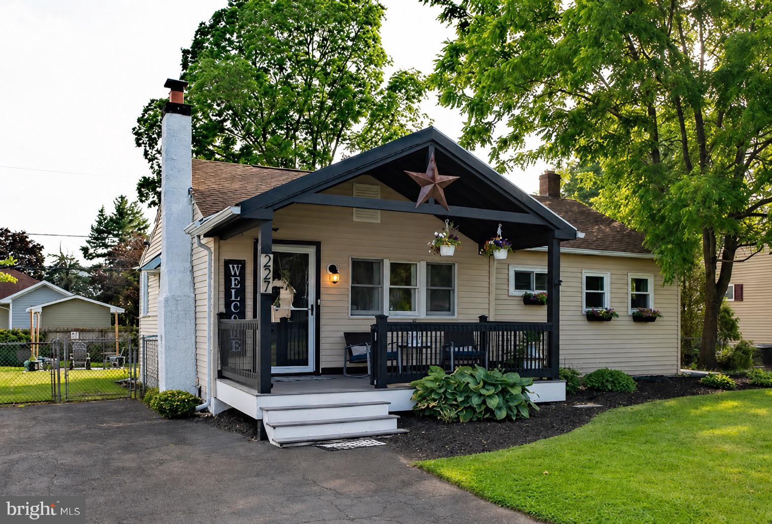 Welcome home! 227 Roberts Avenue, is a beautifully updated home nestled in one of Horsham Township's most desirable locations. Offering the perfect combination of character, modern updates, and exceptional indoor-outdoor living, this move-in-ready property is designed for both everyday comfort and effortless entertaining.

Step inside and be greeted by an impressive open-concept layout featuring soaring vaulted ceilings, exposed beams, skylights, and an abundance of natural light. The spacious great room creates a warm and inviting atmosphere while seamlessly connecting to the heart of the home—a stunning chef-inspired kitchen that is truly a cook's dream. Complete with an oversized center island, double wall ovens, beverage refrigerator, abundant cabinetry, and generous prep space, this kitchen was designed to gather family and friends together.

The thoughtful updates continue throughout the home with updated flooring, fresh paint, recessed lighting, replacement windows, an electric fireplace, and modern finishes that blend style and functionality. Recent improvements include a new mini-split system, Honeywell thermostat, updated attic fan, replacement gable vents, security camera system, and numerous enhancements that make this home truly turnkey.

Outside, you'll discover your own private backyard oasis. Whether you're hosting summer barbecues on the expansive deck, gardening, entertaining guests, or simply unwinding around the fire pit under the stars, this outdoor space offers something for everyone. The beautifully maintained yard, mature landscaping, and storage shed create a setting that feels both peaceful and functional.

Conveniently located near shopping, dining, parks, major commuting routes, and everything Horsham has to offer, 227 Roberts Avenue delivers the rare combination of location, lifestyle, and updates that today's buyers are searching for.

Simply unpack, settle in, and enjoy!