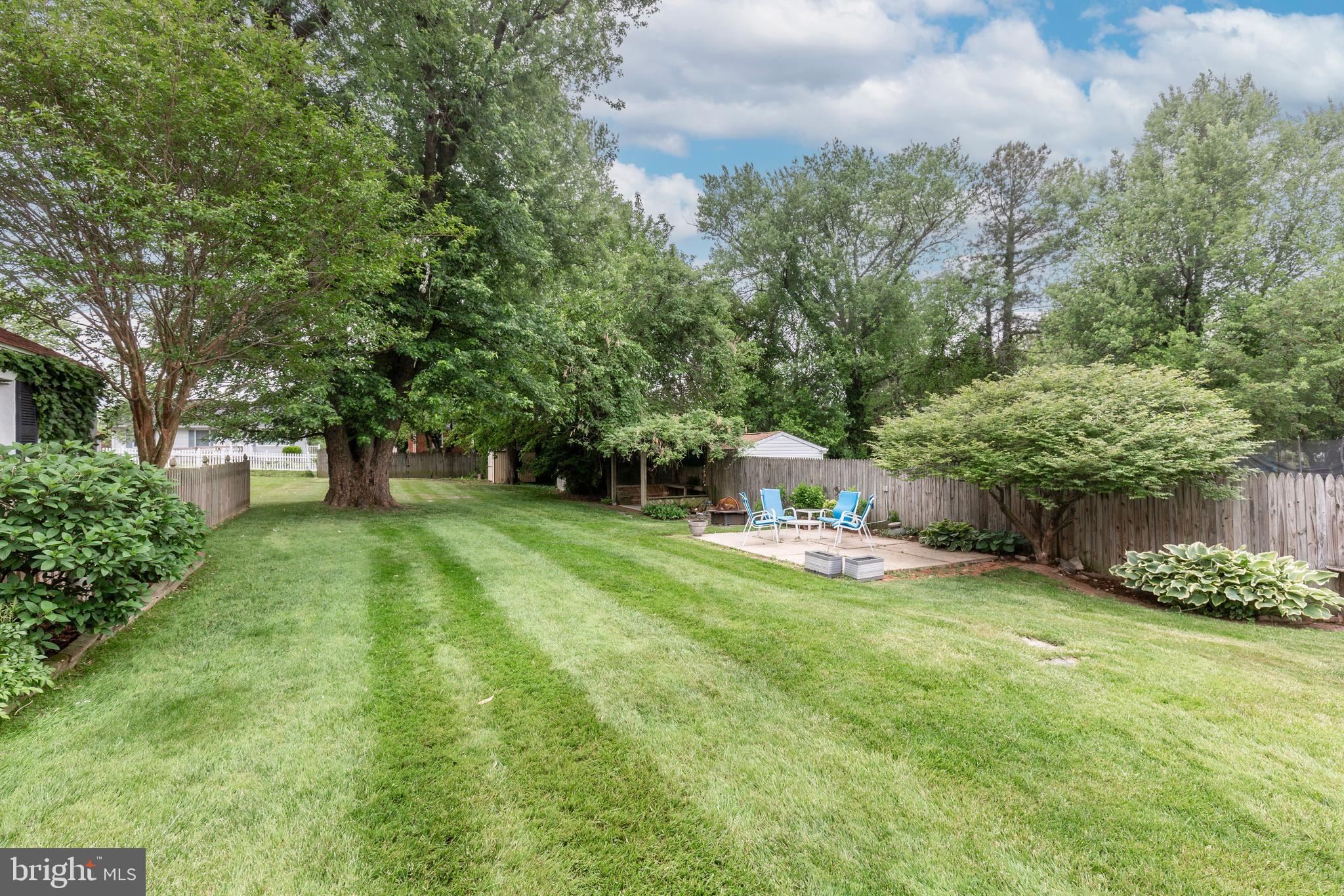 Exceptional value with TWO separately deeded lots included in the sale! The homesite (.16 acres) is
complemented by an additional rear lot (.087 acres), creating nearly a quarter-acre of combined
property. This rare offering provides expanded outdoor living space, added privacy, room for gardening,
recreation, pets, or entertaining, and a level of flexibility seldom found in similar properties. The
additional lot conveys with the sale, making this a truly unique opportunity for the next owner.
And the bonus is how warm & welcoming and truly move-in ready this home is! Beautifully updated home offers comfort & charm, both inside and out. The kitchen features newer appliances and blends functionality with everyday convenience. Hardwood floors throughout the living room, dining room, and both main-level bedrooms. The charming dining room creates a comfortable setting for everyday meals and casual gatherings with family and friends. The main level offers two bedrooms and a full bath, while the expansive upper level features a spacious bedroom with a cozy sitting area — the perfect place for reading, watching  TV, or simply relaxing at the end of the day. 
The lower level has so much to offer, too, providing additional living space perfect for everyday living, entertaining, or gatherings. Enjoy a spacious family room, kitchenette with walk-out access to the rear yard, workshop space, and abundant storage throughout. 
Enjoy the comfort of central A/C, a gas-fired boiler with hot-water radiation, and a backyard paradise just in time for summer! Conveniently located with easy access to 695, commuting is a breeze while nearby shopping, dining, and everyday conveniences are just minutes away. 
Beyond its exceptional care and maintenance, this home offers a flexible floor plan with space that can evolve with your lifestyle. You will appreciate the potential for a future large 2nd  full bath, adding even greater functionality and value. Combined with the spacious layout, abundant storage, and versatile lower level, this home offers both immediate comfort and long-term possibilities! 
A rare opportunity to own a property that combines warmth, character, updates, and exceptional outdoor living!