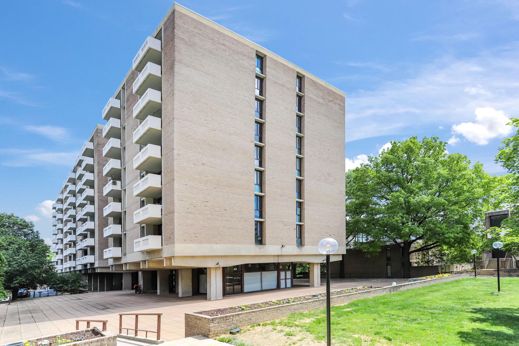 Great bones, great price — welcome to The Carollsburg. This 2-bed, 1-bath unit offers loads of natural light, exceptional closet space, and peaceful views of the park-like courtyard and pool..

The oversized private balcony is a standout feature — whether you're hosting friends or just enjoying a quiet evening overlooking the grounds, it's outdoor, city living at its best.

The unit is ready for your vision: pull back the carpet to reveal the original parquet floors underneath and customize the rest to suit your style. A little work goes a long way here.

Both bedrooms are generously sized, offering comfort and flexibility for a variety of living arrangements, and the bathroom features a convenient walk-in tub with shower. The kitchen is well-equipped with gas cooking and ample storage.

Additional perks include one assigned parking space, and a condo fee that covers all utilities as well as parking — simplifying your monthly expenses.

All of this sits within The Carollsburg's gorgeous 11-acre community grounds — a rare green oasis in SW DC. Step outside and you're minutes from the Wharf, the Smithsonian, the Metro, Safeway, Audi Field, and Nationals Stadium. City convenience, neighborhood feel.