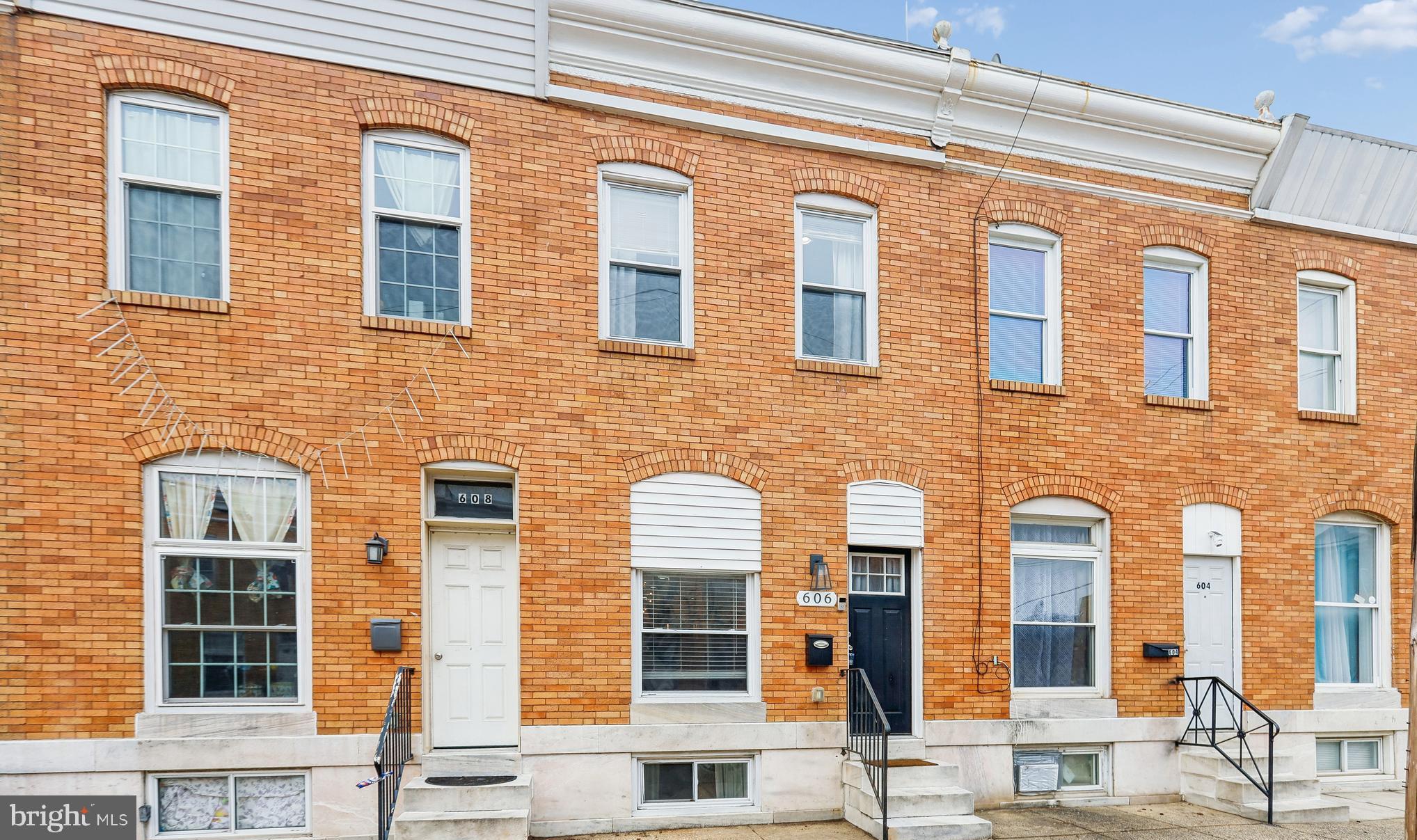 **Closing help available**Conveniently located this fully remodeled townhome blends history we adore, with all the modern updates we need.  Stepping into the main level you'll enjoy the bright, open layout with coffered ceiling, recessed lighting and exposed  brick wall adding warmth, charm and authenticity.  Kitchen offers center island with quartz countertops and stainless appliances, gas stove, updated cabinets and subway tile backsplash.  Off the kitchen, step out to your deck leading to your piece of paradise, driveway parking in the city!  Primary suite is spacious and has a large, remodeled shower and dual vanity.  Additional bedroom on the upper level with separate, full updated bathroom.  Lower level has recessed lighting making it bright and welcoming for bedroom and bath number 3! Great laundry area or space for an office too.