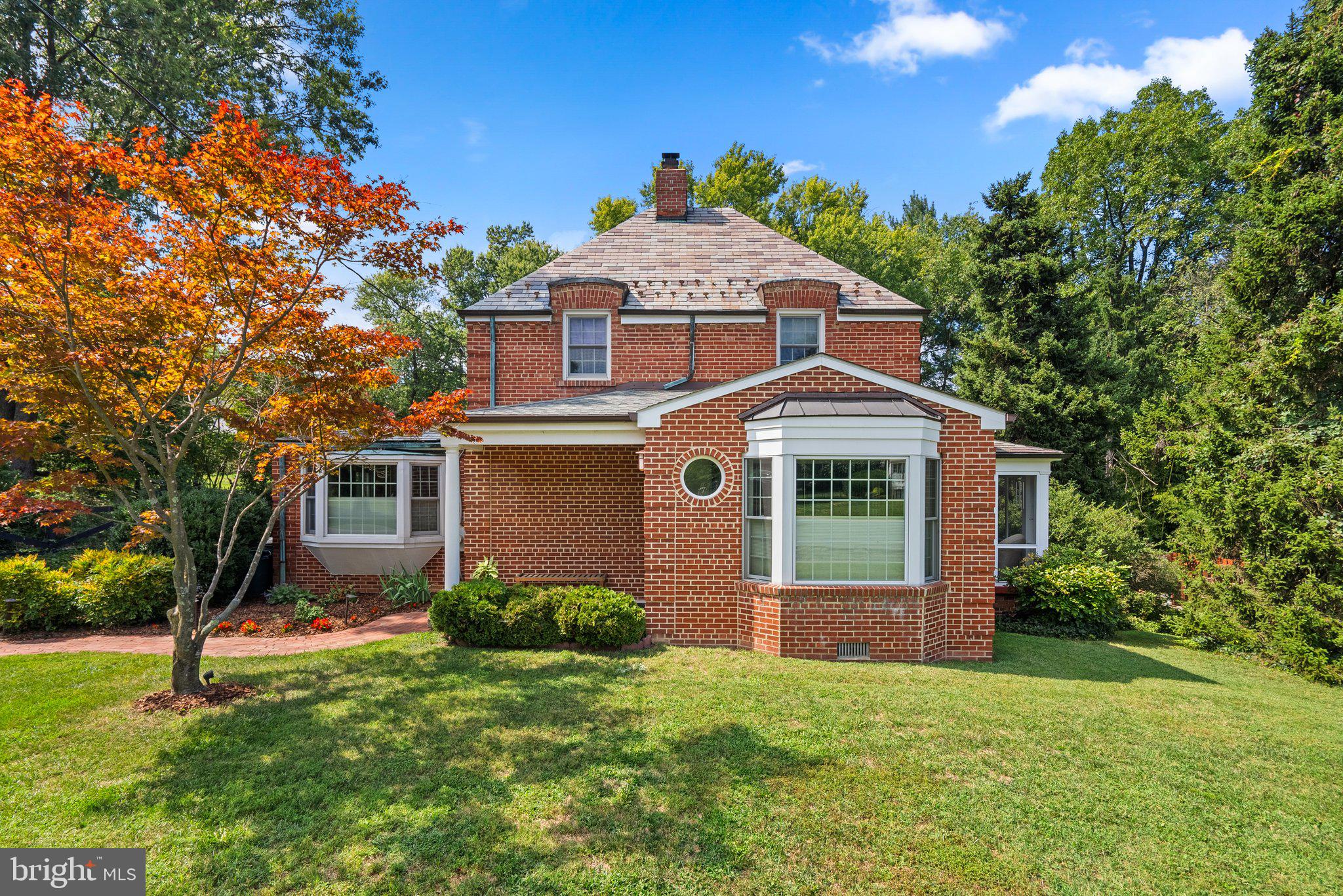 Don't miss this beautifully maintained home where historic charm meets modern convenience—move-in ready and smart home equipped with smart locks, Caseta smart light controllers, and WiFi-enabled thermostats.


A standout feature is the ground-level in-law suite with a separate entrance, complete with a bedroom, full bath, and kitchenette—perfect for extended family or as an income-generating apartment or Airbnb.


Nestled in a picturesque setting, this home features a cozy living room with a woodstove, accented by built-in bookshelves. The bright white kitchen boasts granite countertops, a detailed tile backsplash, a gas stove, barstool seating, and a spacious pantry. Adjacent to the kitchen is a home office/den with a lovely bay window. Hardwood floors and neutral paint flow throughout the home.


Designed for both comfort and entertaining, the home boasts a formal dining room and a spacious family room, elegantly framed by wood columns. French doors lead to a large bi-level deck, seamlessly connecting indoor and outdoor spaces. A fully restored screened side porch adds to the home's charm, offering a serene spot to relax. A rear mudroom and convenient half bath complete the main level.


Upstairs, you'll find three spacious bedrooms, including a gorgeous 500 sq. ft. owner's suite with a cathedral ceiling and a stunning ensuite bath with marble tile, a soaking tub, and a separate shower.


The lower level provides storage, a workshop area, and a laundry room. The beautifully landscaped yard includes a bluestone patio and mature trees, offering a private and serene setting.


Additional highlights include a brand-new HVAC system and a driveway that easily fits 4 cars.


Located near the Hillandale Swim and Tennis Association, this home offers timeless charm, modern amenities, and a prime location. Schedule your private tour today!