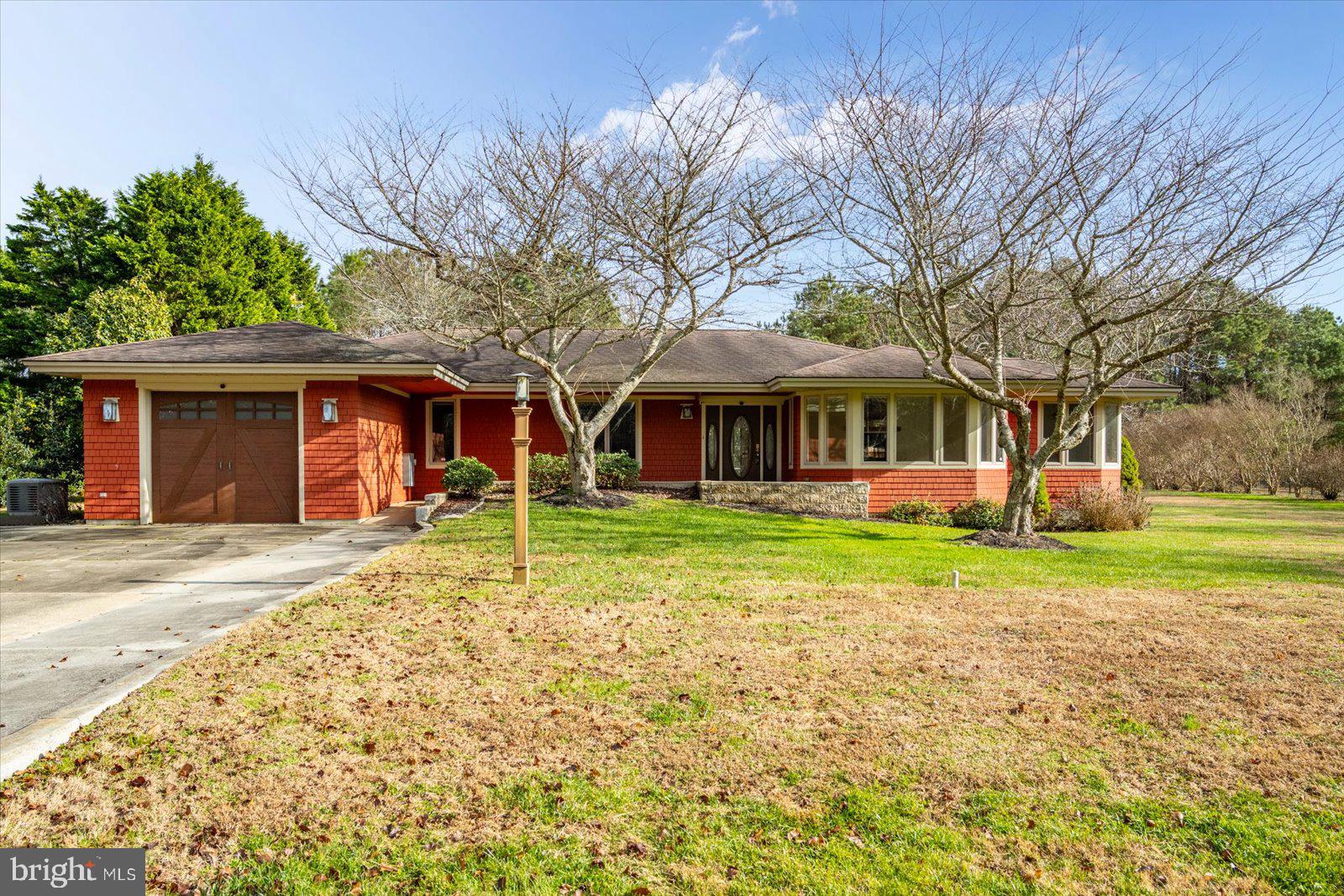 Located in the waterfront community of Stray Fox off Assateague Road, this custom-built 3-bedroom, 2-bath home sits on over an acre and offers comfortable one-level living in a quiet setting! The home features an expansive deck overlooking the backyard, as well as a three-season porch for additional outdoor living space.
Inside, the layout includes a living room with a double-sided gas fireplace, a spacious dining room, and an eat-in kitchen with an additional sitting area. The home was designed with accessibility in mind and is handicap accessible throughout. Freshly painted and well maintained, it includes quality updates and a newer HVAC system. The large lot provides plenty of room for outdoor activities, gardening, or future improvements. The peaceful setting offers privacy while still being part of an established community. Conveniently located between Ocean City and downtown Berlin, the home provides easy access to beaches, restaurants, schools, golf courses, and marinas. Schedule your showing today!
