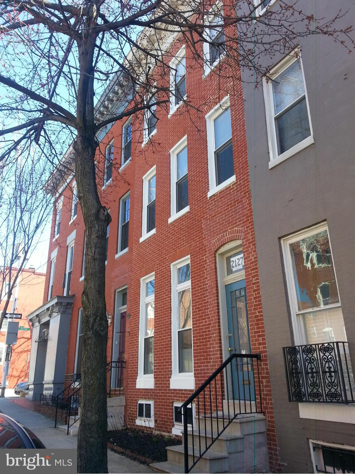 Newly renovated with taste and style. This 2 story apartment is situated on the second and third floor of this stately Victorian townhome. All wood floors, wood cabinets, granite counters, 2 contemporary bathrooms, and a balcony plus a rooftop deck. Ideally located in the heart of Butchers Hill just a few blocks walk from Johns Hopkins Hospital complex, too tired to walk, take the Hopkins shuttle.