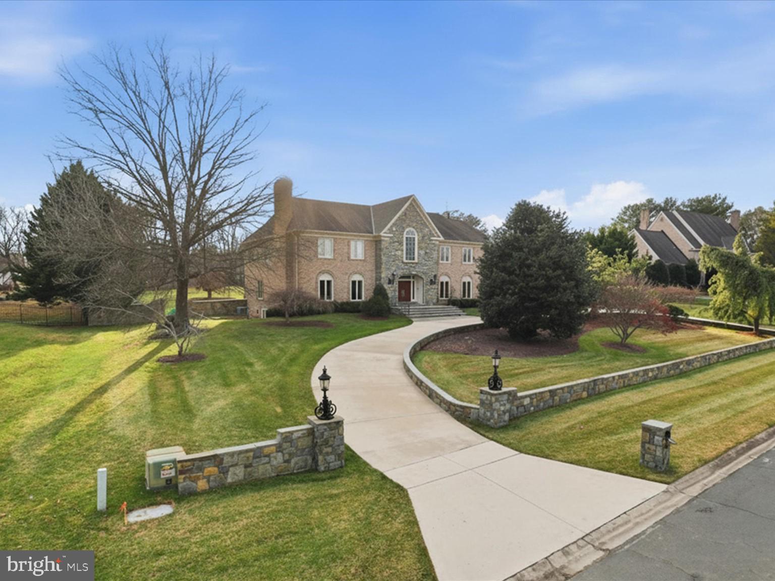 Custom built brick colonial in prestigious POTOMAC MANOR community. 2.1 acre lot on quiet cul-de-sac. Fenced flat backyard with lighted tennis court. Beautifully renovated throughout with quality millwork and architecturally interesting moldings and details. Grand two story foyer with balcony overlooking foyer and family room. Luxurious  formal living and elegant formal dining. Gourmet kitchen with heated Italian travertine floors and wet bar, and wall of windows overlooking the backyard and flows into the family room. High grade Thermador, GE Advantium and Bosch appliances. Additional caterers (2nd) kitchen. Perfect for entertaining and informal gatherings. Large paneled library with adjacent separate wet bar and storage. Spacious family room with cathedral ceiling and custom carved arches and a floor to ceiling stone wood burning fireplace. Main level in-law/guest suite and additional full bath and formal powder room. Five bedrooms and three renovated bathrooms upper level. Large primary suite with fireplace. Walk-in closet with organizer and granite atop island. Luxury primary bath with vaulted ceiling, skylights. Walkout level basement finished with large open recreation room, billiards area, game room, wet bar and 6th full bath. Beautiful landscaping. Great location! Close to Potomac Village shopping center. Minutes to multiple golf courses/clubs and Great Falls Park. Easy commute to DC and NVA. Great public schools: Potomac ES/Hoover MS/Churchill HS.