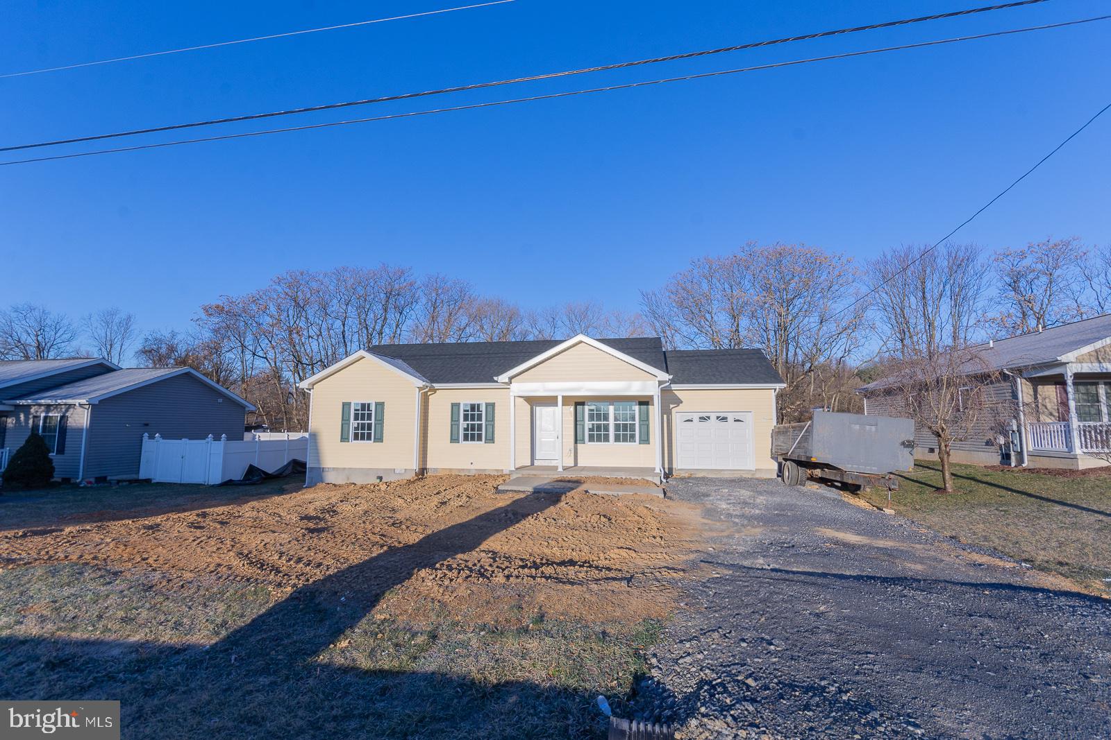 Step into the epitome of modern comfort and style in this brand-new, charming rancher nestled in the heart of Berkeley County, WV. Boasting three spacious bedrooms and two baths, this home is an invitation to unparalleled relaxation and convenience.

As you approach, a picturesque front porch welcomes you, offering a perfect spot to enjoy the serene surroundings of the lovely neighborhood. The open lot allows for ample natural light to grace the interior, creating an inviting ambiance throughout.

Step inside to discover a beautifully crafted living space adorned with high-quality finishes. The kitchen is a chef's dream, featuring sleek granite countertops that perfectly complement the chic LVP (Luxury Vinyl Plank) flooring. A complete appliance package ensures both functionality and sophistication, making meal preparation an absolute pleasure.

The master bedroom is a private sanctuary, boasting a lavish ensuite bath that exudes tranquility. Two additional bedrooms provide versatility for a growing family, guests, or a home office, each designed with comfort in mind.

Convenience is key with the attached one-car garage, providing shelter for your vehicle and additional storage space. Moreover, being a new construction, you can rest assured that everything is fresh, efficient, and designed for modern living.

Located in the sought-after south end of Berkeley County, this residence offers the best of both worlds: a peaceful setting while being conveniently close to amenities and major thoroughfares. Embrace the opportunity to make this exceptional home yours, with availability starting from March 1st, 2024.

This house harmonizes contemporary elegance with practicality, making it an ideal place to call home for those seeking comfort, convenience, and style in a delightful neighborhood.