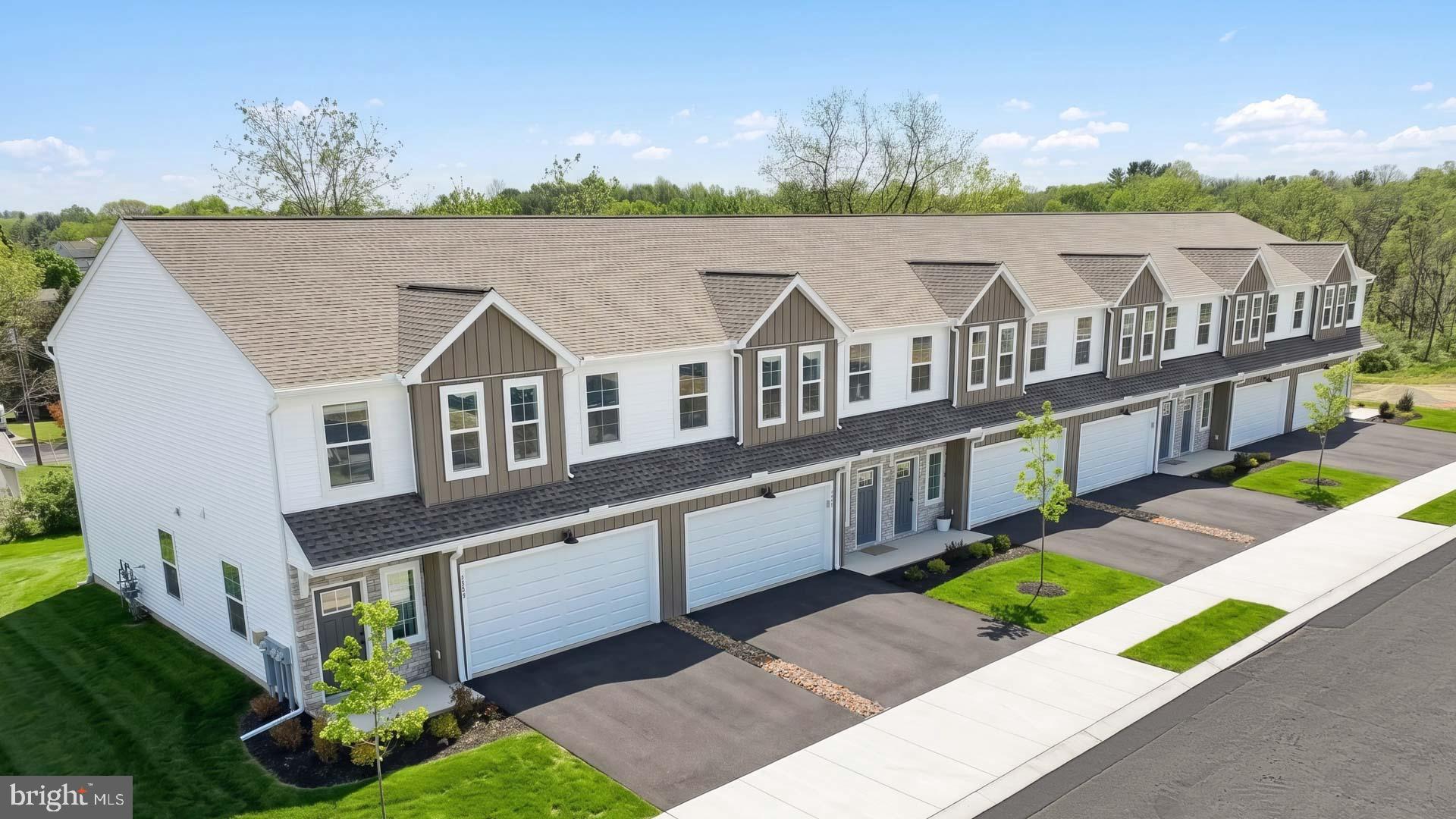 This spacious, end-of-row townhome is well-equipped with a 2-car garage, 9’ ceilings on the first floor, and a patio for outdoor living. The kitchen, featuring stainless steel appliances and quartz countertops, opens to the dining area and sunny family room. On the 2nd floor, the owner’s suite includes an expansive closet and a private bathroom. Across the hall there are 2 additional bedrooms, a full bathroom, and a convenient laundry room. The community is convenient to Harrisburg, Hershey, and major highways. Images may include virtual furnishings for illustrative purposes only.