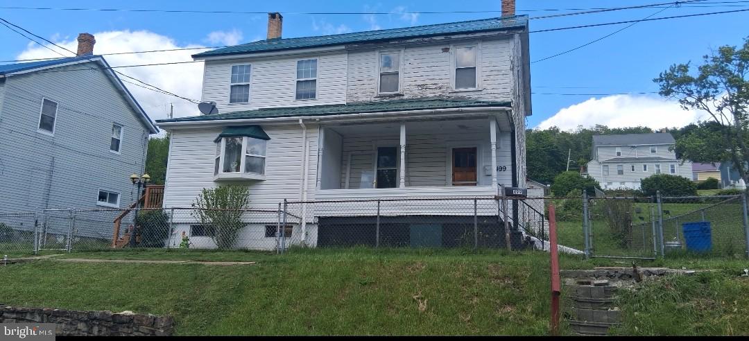 Welcome to Windber, PA. This quint half home is a charming fixer-upper in a peaceful small-town community.  Offering 832 square feet, it features 2 bedrooms, 1 full bath, and an additional toilet in the room off of the kitchen. A side entrance leads to a convenient mudroom, perfect for storing shoes and gear. The basement also has Bilko doors for easy access. situated on a 0,084-acre lot, it also includes dedicated parking right in front. Full of potential, this property is ideal for investors or buyers ready to add their personal touch with some TLC. 
PROPERTY BEING SOLD AS-IS, WHERE-IS.