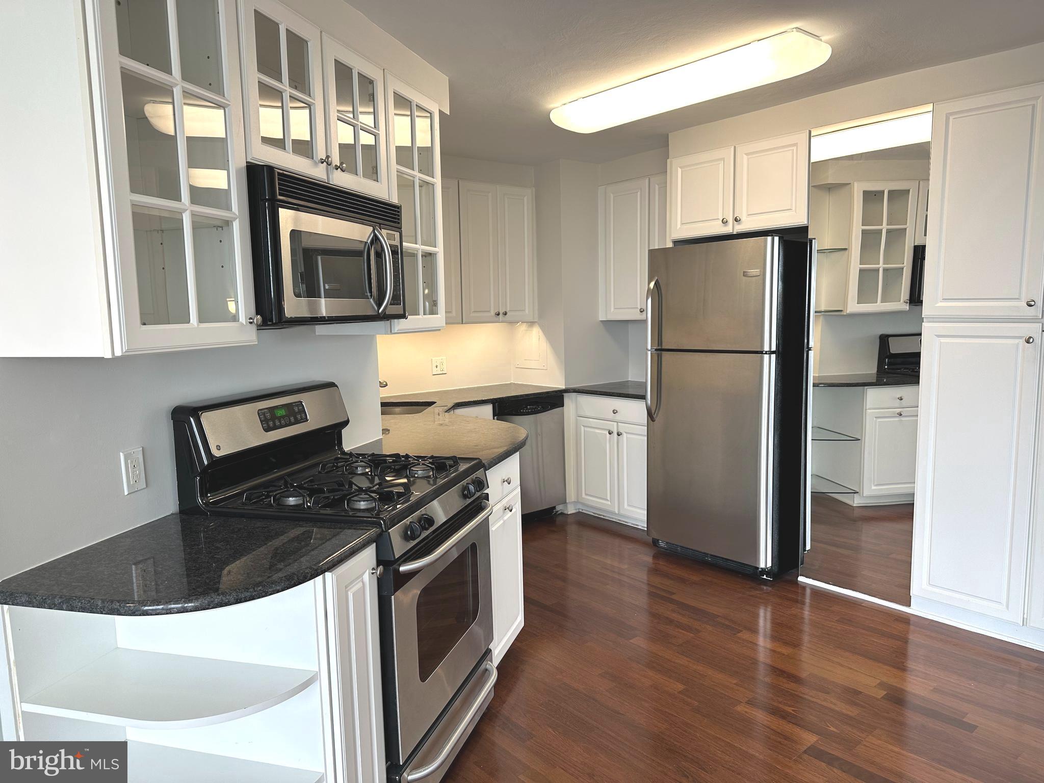 You will love living at Sutton Terrace! It is luxurious living with amenities,  friendliness and the feeling of being on vacation year round. This 1322 square foot 1 bedroom + den is mostly used as a 2 bedroom condo has 1 ½ baths and was reconfigured to enhance the openness of the condo.There is a 24/7 door person building with excellent support staff to help you with packages, groceries and other needs.  As you step into the property, there is a wide open space allowing you to see the entire wall of windows and views beyond. The gleaming dark wood floors are the perfect backdrop for elegant rugs. The property was just painted in designer colors and the bedroom/den are newly carpeted with lovely soft neutral colors. The handsome black granite countertops and white kitchen cabinets in the kitchen floor plan were redesigned to maximize the efficient use of the space. The slight curve and the way it is contiguous to the kitchen gives the dining area character.  It has windows for air flow on nice weather. The wall scones and dining room fixture provide subtle, soft lighting. There is a gracious flow of the dining room into the living room. The long end of the living room can be used as another sitting area or a dining area. The view from this 9th floor allows you to see over the treetops and the city in the distance. Take the hallway to the left, the den /2nd bedroom is on your immediate right with a full closet. The hall continues to a linen closet on the right and a big walk in closet on the left. The wash/dryer is on your left. As you walk ahead, the angled door to the bathroom leads to the enlarged bathroom. The long vanity and counter have plenty of storage. Look at that beautiful glass wall in the enlarged shower! This shower is easy to use and has so much space. The primary bedroom is roomy and has another wall of windows. The library and fitness center are on the first floor. The newly redecorated social room is used for meeting, speakers, playing cards, games and entertainment. The grounds have lush plantings and are well kept. A beautiful new fence was installed around the perimeter of the lot. The location of the building has easy access to the city, suburbs and airport. Shopping is right across the street. It is a beautiful neighborhood to live in with charming homes nestled close to mature trees and plantings. The pool is open to everyone for a $145 per member. The indoor garage spaces when available (currently available) are $150/month. There is a $2500 refundable move in fee after living at Sutton Terrace for 30 months. The condo fee is $1292/month which includes $971 monthly association fee + capital reserve fee of $143 + masonry loan of $146 until 2/28, and $32 for electric. Also for sale!