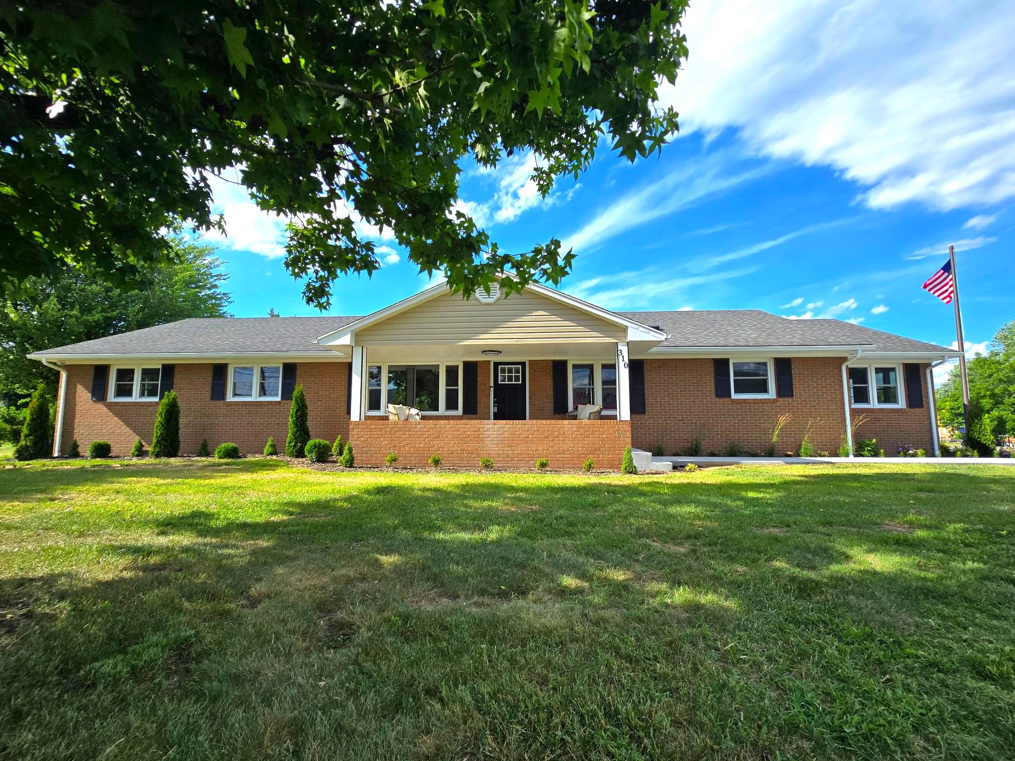 Welcome to one of the finest Homes offered for sale in the Town of Stanley! Nestled on a generous 0.46-acre corner lot, this updated, Lovely Brick ranch-style Home residence boasts an impressive 2,550 square feet of living space, ALL on One Level, offering ample room for relaxation and entertainment! Step inside to find a warm and inviting New interior featuring luxury vinyl plank flooring throughout, a Brand New Kitchen with beautiful Hickory Cabinets, Stainless Appliances, and Gorgeous Black Granite Countertops. Entertain everyone with the Spacious Formal Living Room with picture window or the spacious family room complete with a cozy brick fireplace and glass french doors, creating the ideal spot for gatherings or quiet evenings at home! Lets not forget the three separate eating areas: Breakfast Area off the Kitchen with windows and Mountain views, The Kitchen Bar Area with space for two bar stools, and the Separate Dining Room! The primary suite offers a private retreat with His and Hers Closets and an en-suite bathroom boasting a Large Double sink Vanity with plenty of drawers, and a Porcelain Tiled White Marble Shower with Glass Door! The Hall Bath also comes complete with a Tub-Shower Combo with Tiled Walls and Sliding Glass door! Three spacious bedrooms feature New Carpet and French Door Closets! The fifth bedroom is also set up with Counter-height receptacles, ideal for an Office or Crafts Room! The laundry/mud room comes well appointed with new White Cabinetry, double sink, and coat closet. From there, step into the oversized, Attached Two-Car garage with Epoxy Coated Concrete floor. Outside, the property is beautifully landscaped, with a level yard that invites outdoor activities and relaxation. The exterior lighting and floodlights enhance the charm of the home while providing safety and security. Enjoy breathtaking mountain views from your front yard, creating a picturesque backdrop for your daily life. This home offers the ideal balance of suburban living with easy access to local amenities. Whether you are in search of the Dream Single-Level Home, or a property large enough to be Multi-generational, don't miss the opportunity to make this exceptional residence your own!