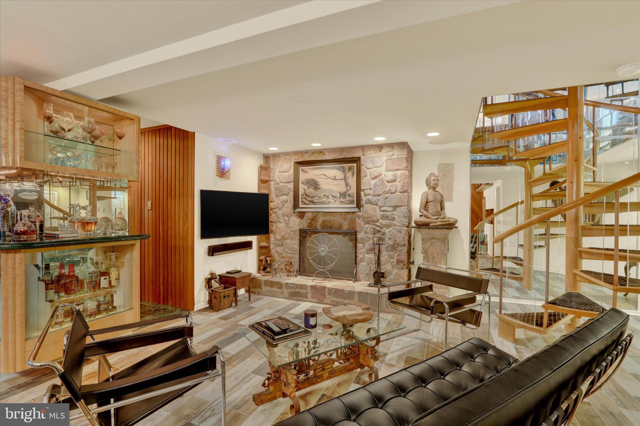 When was the last time you were able to relax and enjoy a day at the Spa or even imagine being at the Spa... sipping on a glass of wine and soaking in a hot tub with surround marble walls and natural sun-light beaming down thru two story sun room window system... Then stepping into a sauna or even a steam room before you then relax on the cozy couch by a wood burning stone fireplace? IMAGINE NO MORE!! 58 Sutphin Pines is your endless days of spa treatment!  Nestled in the serene community of Sutphin Pines, this exquisite end-of-row townhouse, tucked away in the back of the development, offers a harmonious blend of contemporary elegance and modern comfort. With 2,931 square feet of meticulously designed living space, this home is a ONE-OF-A-KIND sanctuary that invites you to unwind and indulge in a luxurious lifestyle. Step inside to discover an open floor plan that seamlessly connects the living, dining, and kitchen areas, perfect for both entertaining and everyday living. The gourmet kitchen is a chef's dream, featuring upgraded countertops, a built-in range, a built-in microwave, and a sub zero refrigerator all complemented by sleek cabinetry and a spacious eat-in area. Natural light floods the home through double-hung windows and skylights, enhancing the beauty of the rich wood flooring throughout. The main level also boasts a convenient half bath, two-story ceiling in Family Room, Sliding  "art deco" etched glass pocket doors to balcony of spa-level, and a dining area that effortlessly accommodates both intimate dinners and larger celebrations. Retreat to the luxurious primary suite, complete with a walk-in closet and a spa-like primary bath featuring a large walk-in shower and separate steam room with marble tile surround. At night be amazed at the celestial etched glass, back-lit, painted, custom made, ceiling. Something you have never seen before but will complete the end of day (post spa) or just work to make you relax and feel like you are sleeping peacefully outside.  Two additional well-appointed bedrooms provide ample space for guests or a home office, ensuring comfort for all as they share a full upgraded bathroom. The lower level "SPA  LEVEL" offers endless possibilities, whether you envision a game room or a family room, adorned with a stunning stone fireplace, that creates a warm and inviting atmosphere, ideal for cozy gatherings. Spend your evening in the hot tub after a long day or in the sauna that exists in this space along with shower. The built in custom bar area completes this dream day get-a-way space. A dedicated laundry area on the upper floor adds to the convenience of this thoughtfully designed home. Step outside to enjoy the community amenities, including a sparkling in-ground pool and tennis court, perfect for active lifestyles. The association takes care of common area maintenance, lawn care, and snow removal, allowing you to focus on enjoying your new home. This property is not just a home; it's a lifestyle choice that embodies comfort, luxury, and community. Experience the perfect blend of elegance and functionality in this exceptional UNIQUE residence. Walk thru video available upon request.