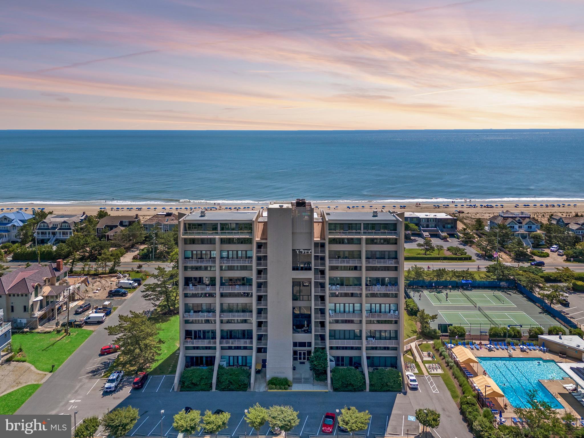 If you are looking for spectacular Atlantic Ocean views, don't miss this stunning residence located on the 9th floor of the iconic 21 Ocean building nested between the Atlantic Ocean and Cape Henlopen State Park. You will certainly enjoy the comfortable and well appointed living and dining room as well as the spacious primary suite. A comfortable guest bedroom complete with a desk perfect for those who work from home.  The unit also includes a stackable washer/dryer. This unit has a split level floorplan. As a resident of North Shores, you'll enjoy exclusive access to top notch amenities, including a pool, tennis courts, marina, kayak launch, tot lot, and a private beach with umbrella and chair service.