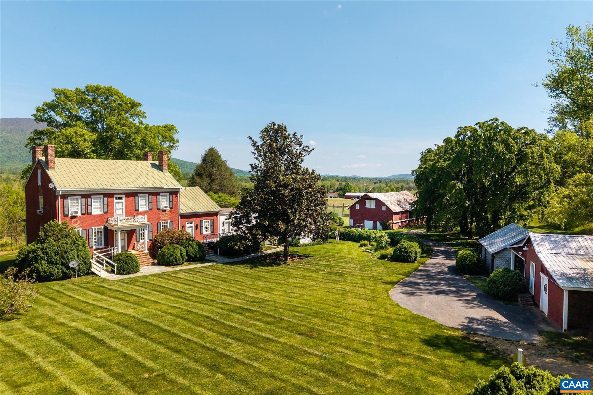 Glenthorne Farm (c. 1809) is a Federal Style masterpiece in the heart of the Rockfish Valley. This 181-acre estate seamlessly blends historic elegance with modern conveniences and fiber-optic internet. Anchored by original heart pine floors, refined proportions, 10ft+ ceilings, impeccable property maintenance, and stylish upgrades combine for truly comfortable country living. The property offers sweeping and majestic Blue Ridge Mountain views, plush grass and hay fields, with Glenthorne Stream flowing through the interior of the property with frontage along the South Fork of the Rockfish River. Recreation enthusiasts will enjoy the marked hiking and riding trails, proximity to Wintergreen Resort, and easy access to area attractions. A charming and modernized 1BR 1BA cottage sits privately behind the main house. The property is also perfectly positioned for viticulture, an equestrian center, or a first-class event venue. Glenthorne Farm is a fantastic Virginia farmhouse legacy awaiting its next chapter.,Wood Cabinets