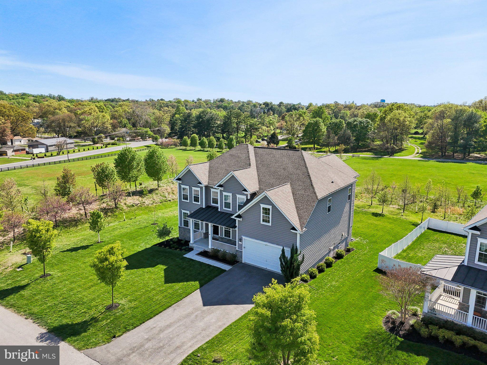 Welcome to this stunning, like-new colonial in the highly sought-after Shipley Meadow community. This expansive home showcases gleaming natural hardwoods throughout the main level and a timeless layout. The formal dining room and living room greet you upon entry, leading into a spacious great room that flows seamlessly into a gourmet kitchen featuring quartz countertops, a drop-in cooktop, double wall ovens, and a bright breakfast nook.

Upstairs, you'll find four generously sized bedrooms, including a showstopping owner’s suite with a tray ceiling, living room–sized sitting area, spa-inspired en suite bath, and three walk-in closets. The fully finished lower level includes a large recreation space and a dedicated theatre room with surround sound—ideal for in home entertainment. Step outside to a large composite deck, perfect for gatherings and outdoor enjoyment.

Conveniently located just minutes from Fort Meade and offering an easy commute to Washington, DC, this exceptional home blends luxury, comfort, and convenience in one of Maryland’s most desirable neighborhoods.