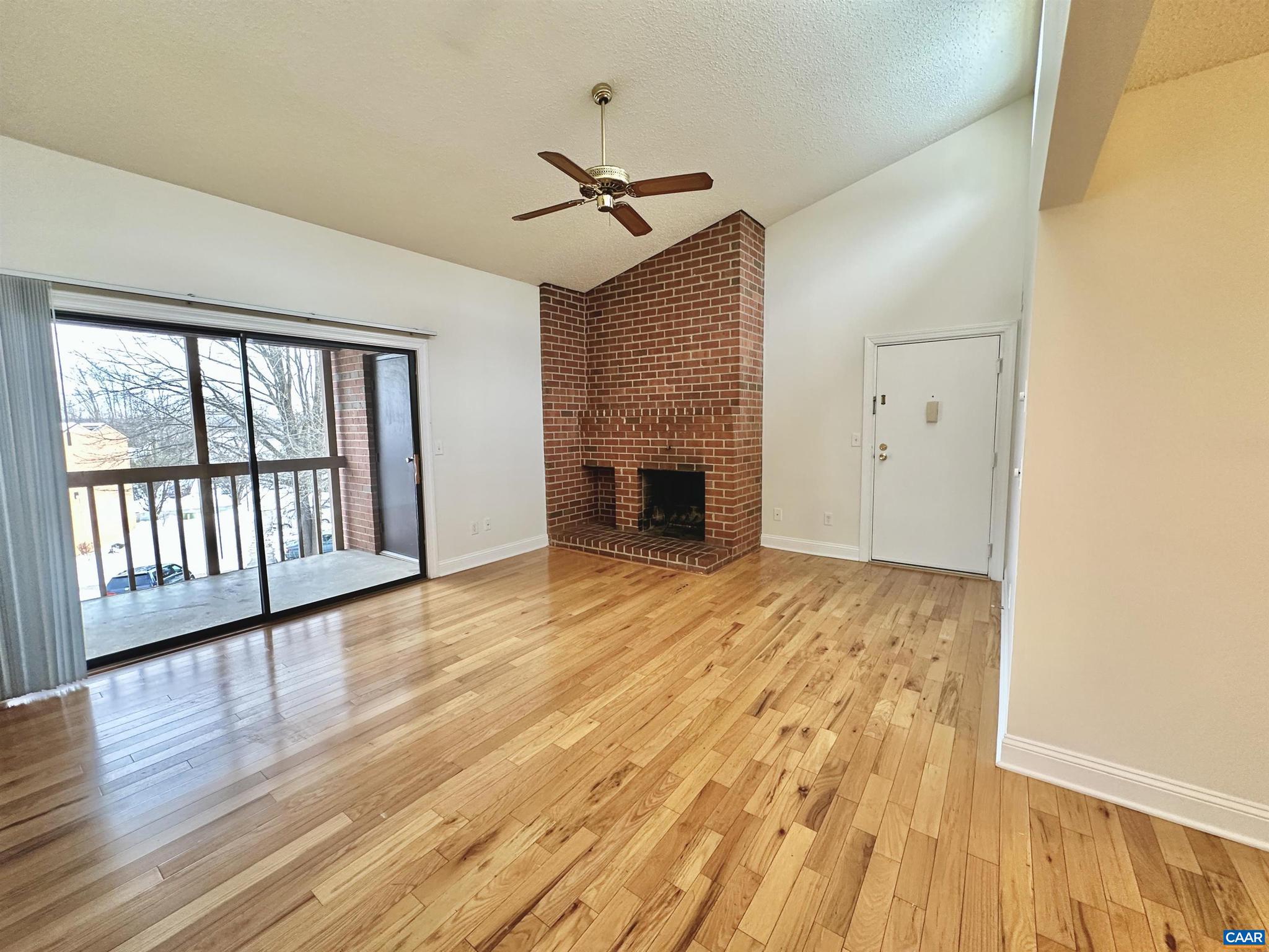Beautifully renovated top-floor one bedroom condo. High vaulted ceilings let in lots of natural light. The condo was renovated to the highest quality with hardwood floors, cherry cabinets, granite countertops, stainless-steel appliances, and ceramic tile. The living room also features a wood-burning fireplace with an extensive brick hearth. The covered porch overlooking Turtle Creek is the perfect place to relax after a long day. There is abundant storage throughout the condo including walk-in closets in the bedroom, a storage room off of the porch, a coat closet, a pantry, and a separate laundry room with a full-size washer/dryer. Kitchen features range, refrigerator, microwave, dishwasher, and garbage disposal.   Luxury condo living on Hydraulic Road, right next to the Shops at Stonefield! . Turtle Creek is an established community with all the amenities: 2 swimming pools, 2 tennis courts, playground, fitness room, clubroom, and walking trails. Per the HOA no pets are allowed.,Cherry Cabinets,Granite Counter,Fireplace in Living Room
