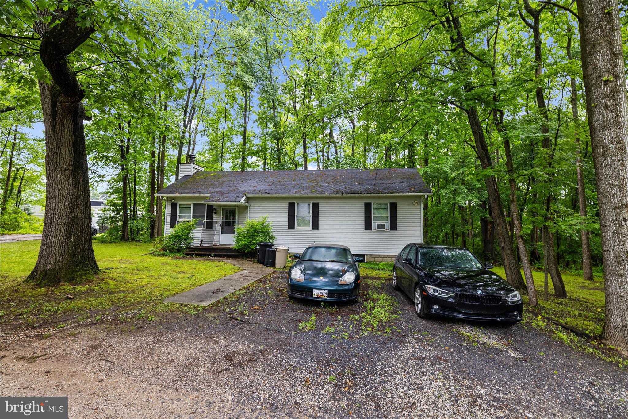 Highly sought-after Mixed-Use Property included in Odenton Town Center Master Plan Section 2.   Currently used as a family compound with garage with 1/2 bath. Directly in back of Odenton Self Storage with shared driveway easement.  SEE DRONE VIDEO FOR THIS PRISTINE PROPERTY !  Access & Maintenance Agreement in place.  See Site plan.