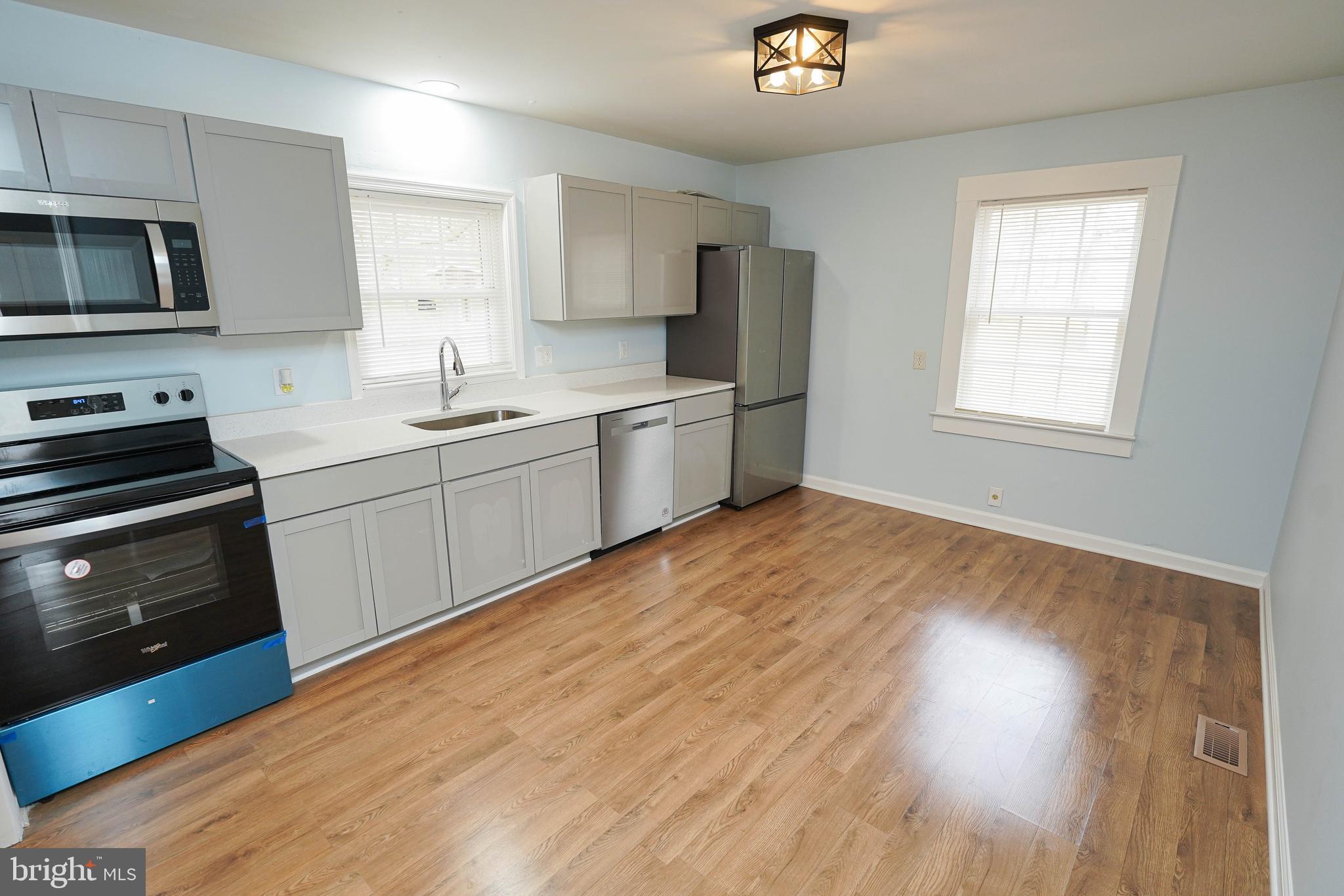 Turn-key adorable and affordable 3BR rancher w/new HVAC, new luxury-vinyl plank flooring throughout, new kitchen, new fixtures, fresh paint throughout, new washer/dryer combo, NEW septic. Nice-sized lot facing forested acreage, yet less than a mile to Rt 13, less than 2 miles to Fruitland's big-box store shopping/dining hub - or 4 miles to more unique shopping, dining, and events in Downtown Salisbury. This home has been transformed, and is ready for you! Bright and breezy living room with triple windows for tons of sunlight, LVP floors, and a new ceiling fan. Dreamy kitchen is new, new, new - new cabinetry, new granite counters, new stainless steel appliances and fixtures. 3 bedrooms with new ceiling fans, new paint, new LVP floors. Full bathroom w/tub/shower combo, new vanity and fixtures, LVP flooring. Utility room w/new LVP flooring leads out to the spacious rear yard. Call today to call this charming house your new home! Sizes, taxes are approximate.  *Note - although the forested acreage across the street is not currently built on, and has been wooded land for decades - of course the seller, nor the listing agent cannot guarantee there will never be a home there sometime in the future*