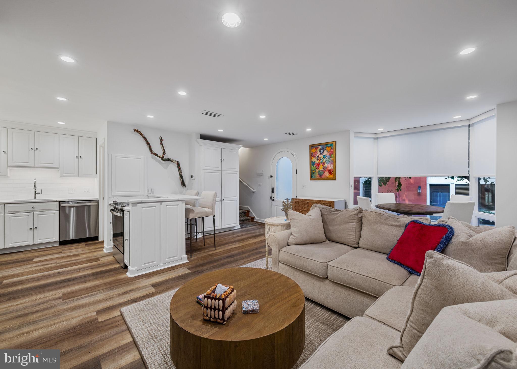 Townhouse privacy meets condominium amenities in this beautifully updated three-bedroom, two-and-a-half bathroom Wanamaker House townhome featuring three levels of sun-kissed living space and a prized Rittenhouse Square location just steps from the namesake park.

Inside this 1,900-square-foot residence, soaring ceilings with recessed lighting, lovely new flooring and expansive floor-to-ceiling windows create a bright and airy ambiance throughout. Charming forecourt gardens and an arched entry door welcome you into a gracious foyer with a custom wardrobe. Ahead, the spacious living/dining area invites you to relax and unwind alongside a wall of built-ins, an electric fireplace, and a dramatic bay window framing views over quiet and quaint Chancellor Street. The updated open kitchen impresses with abundant storage, new countertops and tile backsplashes, a breakfast bar and new stainless steel appliances, including a glass range, side-by-side refrigerator, and dishwasher. A lovely powder room completes the well-planned main level.

Head upstairs to find the full-floor primary suite featuring a king-size bedroom with a bay window and an oversized custom walk-in closet with double hanging rods, shelving, and drawers. A seeded glass door opens to the en suite spa bathroom that boasts a jetted soaking tub, frameless glass shower, and double marble vanity topped by an illuminated mirror. On the top floor, two spacious and sunny secondary bedrooms share an updated full bathroom with a large tub/shower and a vanity with generous countertop space and drawers.

Central HVAC, additional closet space, and a new in-unit washer-dryer add exceptional convenience. This home also offers direct access to the Wanamaker House’s park-and-lock garage. A parking spot, conveniently located right outside the townhouse’s back door, is available for purchase for an additional fee.

Residents of the rarely available Wanamaker House townhomes enjoy full access to the adjacent condominium tower’s elite amenities, including 24-hour doorman service, package receiving and storage, a residents’ lounge, a state-of-the-art fitness center, and the wonderful rooftop pool and sundeck.

From this outstanding location within the Rittenhouse/Fitler Historic District, you’re surrounded by the coveted neighborhood’s hundreds of renowned restaurants, nightlife venues and shops. Enjoy immediate proximity to Philadelphia’s best historic sites, museums, universities, Schuylkill River Park, Center City amenities, and top-rated schools. Nearby PATCO stations, 30th Street Station and Philadelphia International Airport provide easy access to the rest of the city or wherever your next adventure takes you.
