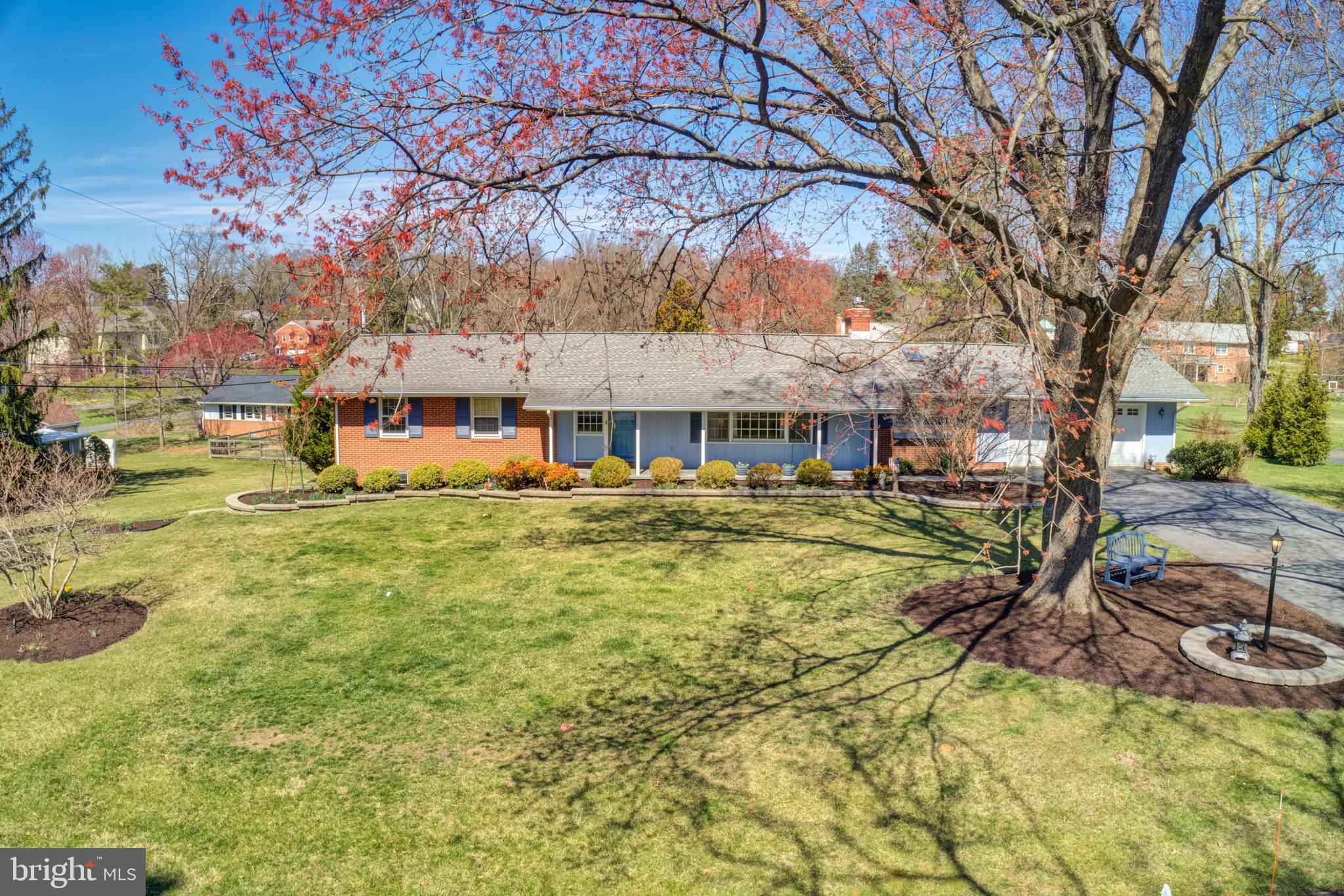 Spectacular Five-bedroom, three-bathroom ranch-style home situated within the Howard County School District. Open floor plan features gleaming hardwood floors and abundant natural light throughout. Main level highlights include gourmet kitchen with granite countertops, ceramic tile flooring, unique Pella greenhouse window, and custom 42-inch cabinetry; cozy den with a gas fireplace; primary suite with newly remodeled full bath; two additional bedrooms and another updated full bathroom with stacked washer and dryer. The huge finished lower level could be used as an in-law suite. The bright open space with separate rear entrance offers gorgeous luxury vinyl plank flooring, a spacious family room and dining area with wet bar, an additional updated full bathroom, 4th bedroom, and a fifth bedroom currently used as open living area, its own full-size laundry area, and an extensive utility area. The property spans ¾ of an acre with mature landscaping. Additional outstanding features include Generac whole house generator, central air conditioning with UV light filter and warm gas heat, a security system, two sump pumps, oversized two-car garage with a professional epoxy painted floor, extra storage in a lighted, cement-floored crawlspace and under deck. Warm Gas Hot Water Baseboard heating.  One-level living at its finest and is move-in ready. 3D Virtual Tour available soon!