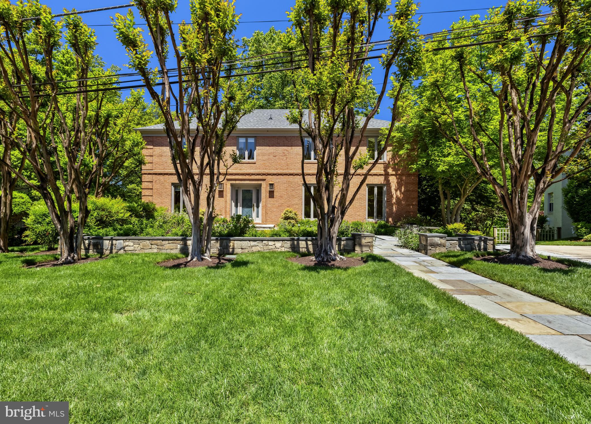 Nestled in a quiet cul-de-sac in the charming Chevy Chase neighborhood, 18 Farmington Court presents a striking Colonial property, offering 4 Bedrooms, 4 Full Baths and 1 Half Bath across 3 masterfully crafted levels, with tasteful design notes such as hardwood floors, recessed lighting, crown molding, wainscoting, and built-ins throughout 4,200 square feet of living space. 

The residence’s sizable front yard, elongated walkway, stone patio, water feature, paved driveway and mature landscaping all contribute to its undeniable curb appeal, beckoning guests and residents alike to step inside and make themselves at home! The inviting Entry Foyer flanks the Living Room and Den. The spacious Living Room offers sizable windows with front yard views, a gas fireplace and stunning crown molding and wainscoting detailing; an ideal setting to entertain large and intimate gatherings alike. The sun-soaked, cozy Den offers a comforting space to enjoy a new read or a Sunday afternoon nap. The Kitchen/Family Room boasts a gas fireplace flanked by built-ins, elegant bay windows overlooking the Rear Patio and a stunning open layout that effortlessly guides residents to the Gourmet, Island Kitchen with bountiful counter space and cabinetry; prepare your favorite meals and enjoy quality time with loved ones simultaneously in this idyllic layout! The Dining Room boasts bay windows and rear yard views as well, creating the perfect dining atmosphere for both formal and casual dining. This level is complete with a Powder Room. 

Ascending to the Upper Level, the Entryway showcases a stunning skylight view. The sizable Primary Bedroom offers abundant natural light, an elegant Sitting Room with built-ins, a vaulted ceiling and skylights, as well as a spa-like ensuite Primary Bath with a built-in wardrobe; start and end your day well in this personal, private sanctuary that truly has it all! The Second Bedroom offers attic access and shared Full Bath with the Third Bedroom. The Fourth Bedroom presents built-in desk space and wardrobes that will give your clothes a brand new home as well! A Full Bath completes the Upper Level’s offerings. 

Descending to the Lower Level, the Guest Room presents a home away from home for visitors, complete with an ensuite Full Bath and built-ins. The spacious Recreation Room offers a gas fireplace, Rear Patio access, built-ins as well as a built-in desk; from a Game Room to a Fitness Center to an at-home Movie Theatre – this space offers endless opportunity for design! This level is complete with a Mud Room with 2-car Garage access, Storage Space and the Laundry/Utility Room. 

Surrounded by treetop views and overlooking Coquelin Run, the Rear Patio, complete with a charming pond, offers an enchanting space to relax and take in the scenic nature or enjoy al fresco dining with friends and family. Within close proximity to the Chevy Chase Lake Town Center, dining, shopping, local parks and major commuter routes, 18 Farmington Court offers both residential community and enviable privacy all in one convenient location!
