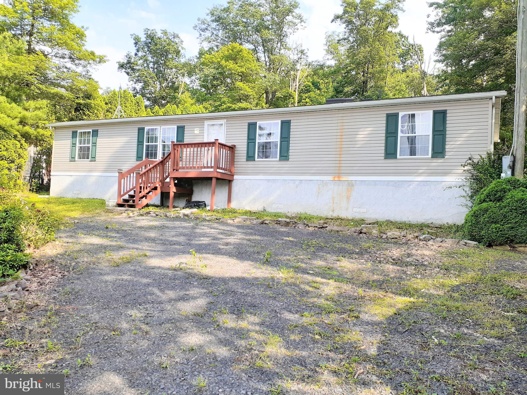 Manufactured home on a concrete foundation ( crawl space type foundation ) in good condition.  3 nice sized bedrooms, living room with vaulted ceilings and convenient first floor laundry off the kitchen.   There are several skylights which make for a light and breezy feel in the home.