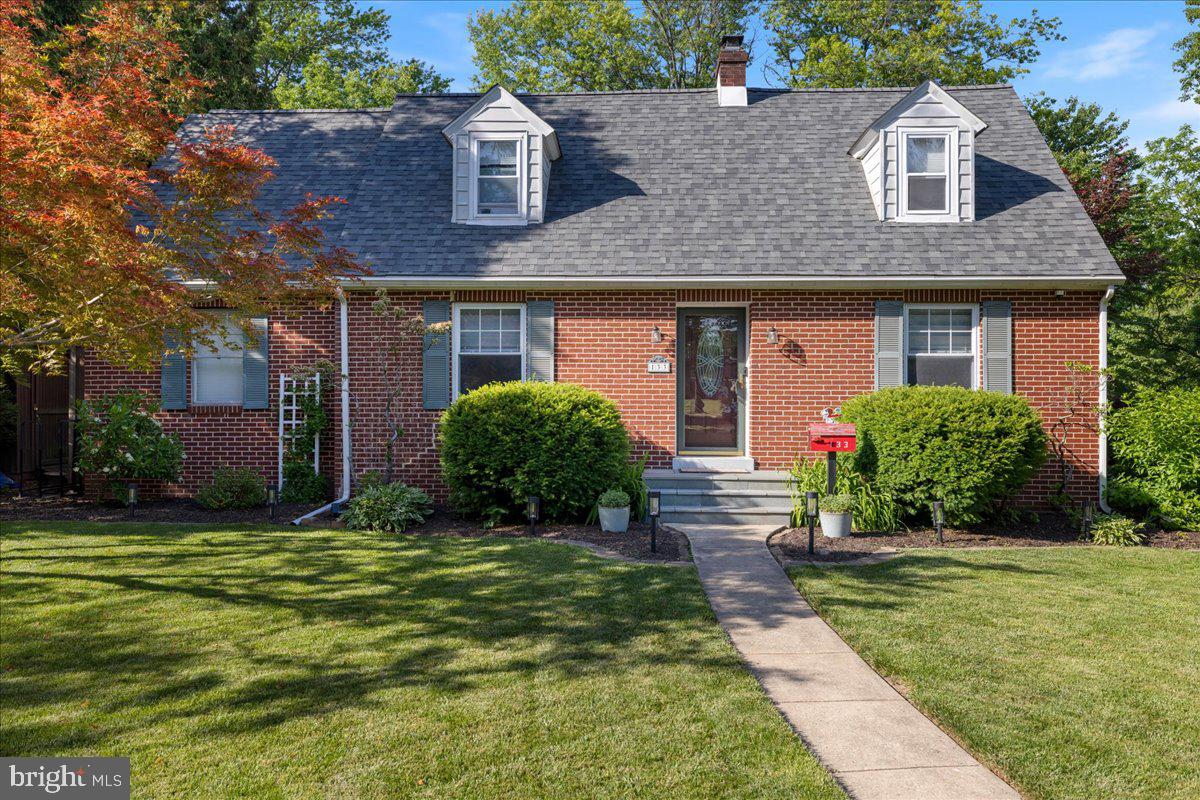 Welcome to 133 Elm Drive, a beautifully maintained brick colonial situated on a picturesque corner lot in one of Lansdale's most charming and established neighborhoods. Framed by elm trees, surrounded by impeccably manicured landscaping, and featuring a newly updated bluestone front patio, this home offers exceptional curb appeal and timeless character from the moment you arrive. Step inside to discover the craftsmanship of a bygone era, including solid plaster walls, refinished hardwood floors, and inviting living spaces filled with warmth and charm. The formal dining room is perfect for gatherings, while the spacious living room features a bay window with a smart power roller blind and a cozy wood-burning fireplace. The kitchen boasts a new floor and provides easy access to the backyard, making entertaining effortless. A powder room completes the main level. Upstairs, the spacious primary bedroom offers three closets, including a desirable cedar closet, and is complemented by two additional bedrooms and a full bath. The finished basement expands the home's living space with brand-new carpeting, making it ideal for a recreation room, home office, or media room. You'll also find a dedicated storage area with laundry facilities and convenient access to the backyard through Bilco doors. A second sump pump with battery backup provides added peace of mind. Step outside to enjoy a spacious, fully fenced backyard featuring a large deck, mature landscaping, and a playset that conveys with the property. This backyard has been the backdrop for countless memories, from outdoor movie nights to gatherings with family and friends. Additional updates include a newer roof (2021), new light switches and outlets, a convertible dining room light fixture/fan, and new ultra-quiet U-shaped window air conditioning units installed in 2026. Conveniently located near downtown Lansdale, SEPTA regional rail, parks, pools, shopping, dining, and Jefferson Lansdale Hospital, this lovingly maintained home offers the perfect blend of character, comfort, and convenience. This one won’t last long; book your showing today!