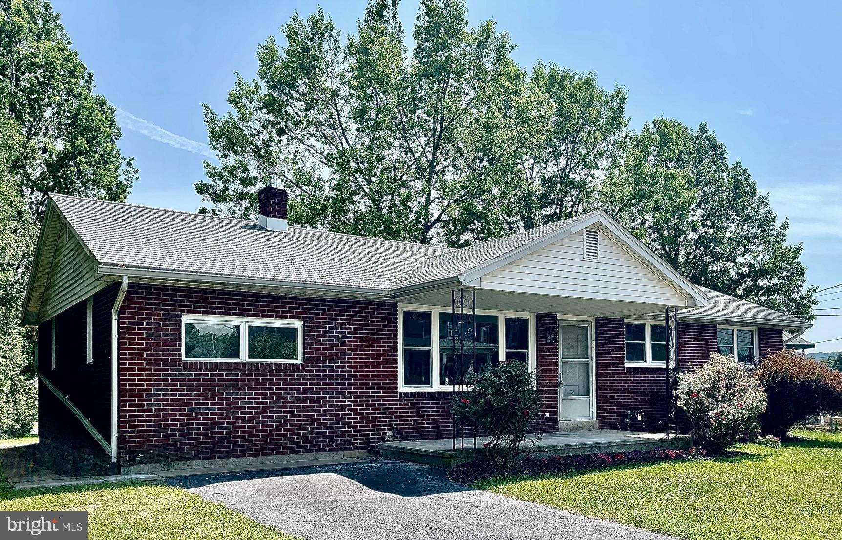 FULLY REMODELED SOUTHERN LEHIGH BRICK RANCH ready for your immediate occupancy! Classic brick construction that you cannot find in today's new homes! This 3 bedroom 2 bath floorplan offers an open concept kitchen, dining area and living room with two bedrooms and a full bath on one side of the home and a discreet master bedroom and bathroom combination on the other. The kitchen with island, granite countertops and never used before stainless appliances in combination with new underlit cabinet is a chef's dream. The updated bathrooms with new vanities, sinks and flooring sparkle. Every single window has been replaced new here giving you energy efficiency and bright light throughout the home. Traditional but newly refinished hard floors are everywhere except for in the kitchen where you have newly installed ceramic time. Central air and newly installed natural gas service with new hot water baseboard heating make this home comfortable in any season. Full and open basement with walk out steps can be used as a great playroom or in home office area. This property sits on a flat lot with off street parking. Enjoy the classic front porch with grilling deck off the rear yard! Playground and parks nearby all laced with sidewalks offer a classic neighborhood feel you can't find in new developments. Conveniently located near Route 309 and 78, your commute to Philadelphia, New Jersey or New York will be a breeze. Come and see this like-new home today-it won't last long!