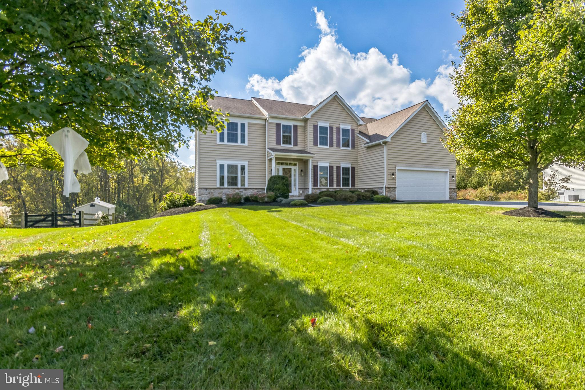 Welcome to 193 Mill House Drive, a stunning colonial home with an exceptional amount of living areas both inside and out.  With nearly 5,200 square feet of thoughtfully designed living space, this home offers 5 spacious bedrooms, 5.5 bathrooms, a finished walk-out basement, and an attached two-car garage, providing ample room for both relaxation and entertaining. As you step into the foyer, you are immediately greeted by the warmth and charm of the home. To your right the formal dining room awaits with beautifully appointed chair rail, crown molding, and ample space for hosting family gatherings. To the left, the formal living room exudes a sense of sophistication with its airy, open layout, perfect for entertaining or quiet relaxation. A private study adjacent to the living room provides a peaceful retreat, while a convenient powder room adds to the functionality of the space. At the heart of this home lies the kitchen, a chef’s dream with its rich wood cabinetry, a large center island, recessed lighting, and polished granite countertops. The kitchen also boasts a bright eat-in breakfast area, complete with sliders leading to a beautiful rear deck. A spacious walk-in pantry provides ample storage, and the seamless flow into the adjoining great room makes this space perfect for daily living and entertaining alike. The great room, generously proportioned and filled with natural light, offers a cozy yet spacious environment for family gatherings. Additionally, a well-sized laundry room is conveniently located on this level. Upstairs, is a very large oversized primary suite which serves as a retreat, complete with an expansive walk-in closet and an ensuite bathroom. The bathroom features a spacious double vanity and a sleek glass shower.  Bedrooms two and three each have their own private ensuite bathrooms, offering comfort and privacy for family or guests. Bedrooms four and five are connected by a Jack and Jill bathroom. The finished lower level provides endless possibilities, whether you envision a family game room, fitness area, or guest quarters. The walk-out design brings in plenty of natural light, and a full bathroom on this level adds convenience. Step outside to the expansive Aztec deck, a true extension of the living space, perfect for embracing outdoor living. Whether you’re hosting summer barbecues or enjoying quiet evening gatherings, this low-maintenance deck is designed for ease and style. A dedicated grilling area, complete with a built-in connection, makes outdoor cooking a breeze. The deck is also equipped with under-deck lighting on an automatic timer, ensuring a warm, inviting ambiance as the sun sets. Relax and unwind while taking in the serene views of the beautiful backyard. With a classic design palette, and move-in-ready condition, this home is truly exceptional. Nestled within the highly sought-after Avon Grove School District and conveniently located near local restaurants, shops, and major highways, this property combines luxury living with a prime location. Don’t miss the opportunity to make this exquisite home your own—schedule your private showing today!