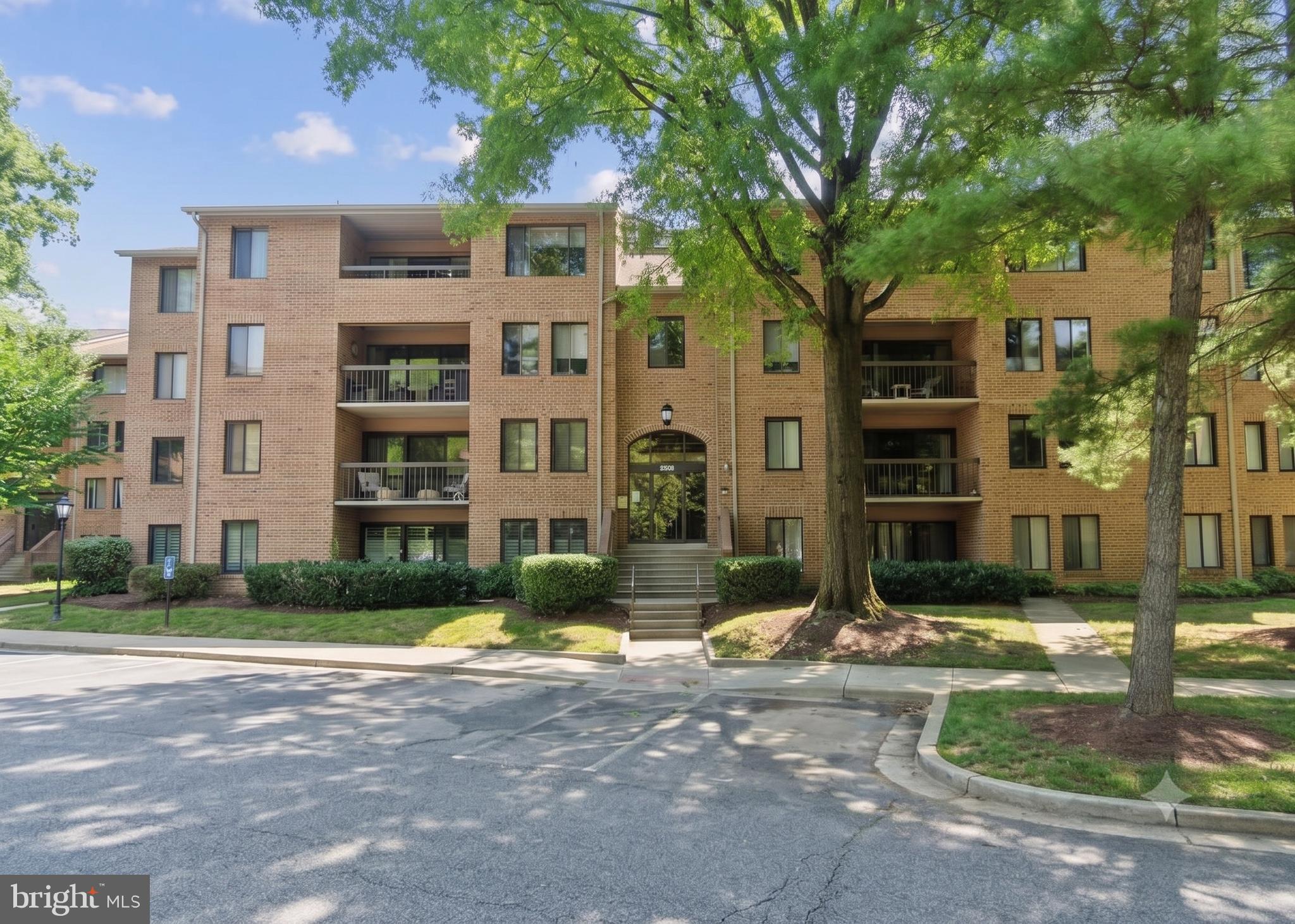 Welcome to this beautifully updated three-bedroom, two-bath residence offering 1,473 square feet of thoughtfully designed living space in the heart of North Bethesda. Generous proportions, an intuitive layout, and a wonderful sense of privacy immediately distinguish this exceptional home.

The interiors have been meticulously refreshed with classic hardwood floors, brand-new luxury flooring accents, fresh designer paint, modern windows replaced in 2015, and contemporary lighting throughout. At the heart of the home, the gourmet kitchen showcases stunning granite countertops, rich hardwood maple Legacy cabinetry, sleek stainless steel appliances, a built-in water filtration system, and abundant storage. The space opens seamlessly to the formal dining area and expansive living room, where sliding glass doors lead to a private balcony overlooking a peaceful canopy of mature trees, a meandering stream, and scenic walking paths.

The spacious primary suite offers a tranquil retreat with a generously sized bedroom, an en-suite bath, and an impressive walk-in closet. Two additional well-proportioned bedrooms and a second full bath provide flexibility for family, guests, or a dedicated home office. A new high-efficiency LG washer and dryer, along with additional storage, further enhance the home's comfort and functionality. Major building improvements provide ultimate peace of mind, including a new roof and upgraded insulation completed in 2025.

Residents enjoy an impressive collection of community amenities, including beautifully landscaped grounds, a resort-style swimming pool with a separate kiddie pool, tennis and basketball courts, a playground, and a welcoming clubhouse with a party room. A responsive on-site management team, plentiful resident and guest parking, and meticulously maintained common areas create an effortless living experience.

Ideally located just moments from North Bethesda Metro, Rockville Pike, Old Georgetown Road, and I-270, this home provides exceptional access to Whole Foods, Pike & Rose, premier shopping, acclaimed dining, and everyday conveniences. Stylish updates, spacious interiors, outstanding amenities, and an exceptional location combine to offer North Bethesda living at its finest.
