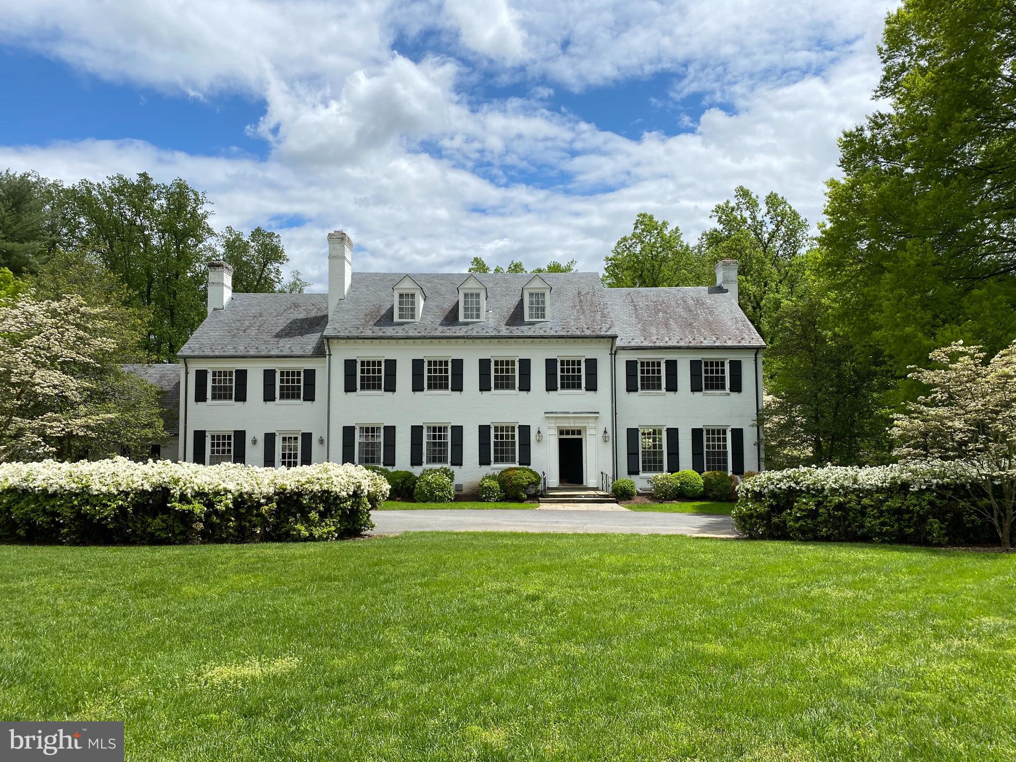 Presenting a spacious estate home located in Potomac’s Golden Horseshoe, one of the area’s most desirable neighborhoods. This property offers over 7,000 square feet of above-grade living space (more than 9,000 square feet including the lower level) on 3.58 acres. It includes 8 bedrooms across the upper levels and 5 renovated bathrooms. The hardwood floors have been recently refinished, maintaining the home's classic character while adding a more updated look. A circular driveway leads to the main entrance. The surrounding grounds feature mature landscaping and a heated swimming pool. Built with classic architectural elements, the home reflects traditional design throughout, including detailed moldings, formal rooms, and a symmetrical layout. At the same time, its generous proportions and thoughtful layout offer flexibility for modern updates, making it well-suited for buyers who wish to personalize or contemporize the space. Interior features include a large double living room and a formal library with built-in shelving, a fireplace, and a wet bar—designed to function as a quiet workspace, reading room, or executive-style retreat. The kitchen is suited for both everyday use and entertaining. The formal dining room opens to a rear patio through French doors, providing views of the surrounding landscape. The main level also includes two powder rooms and a mudroom with a built-in dog bath. Space has been reserved for a potential future elevator. With just a few personal touches, this home offers the opportunity to create a truly customized living environment. Durham Drive in Bradley Farms offers a combination of privacy, scenic surroundings, and convenient access to D.C, Potomac Village and the airports. The custom-built homes on generous lots are part of an established and engaged community. This area appeals to buyers who value quality construction, comfortable indoor/outdoor living, and a well-regarded neighborhood.