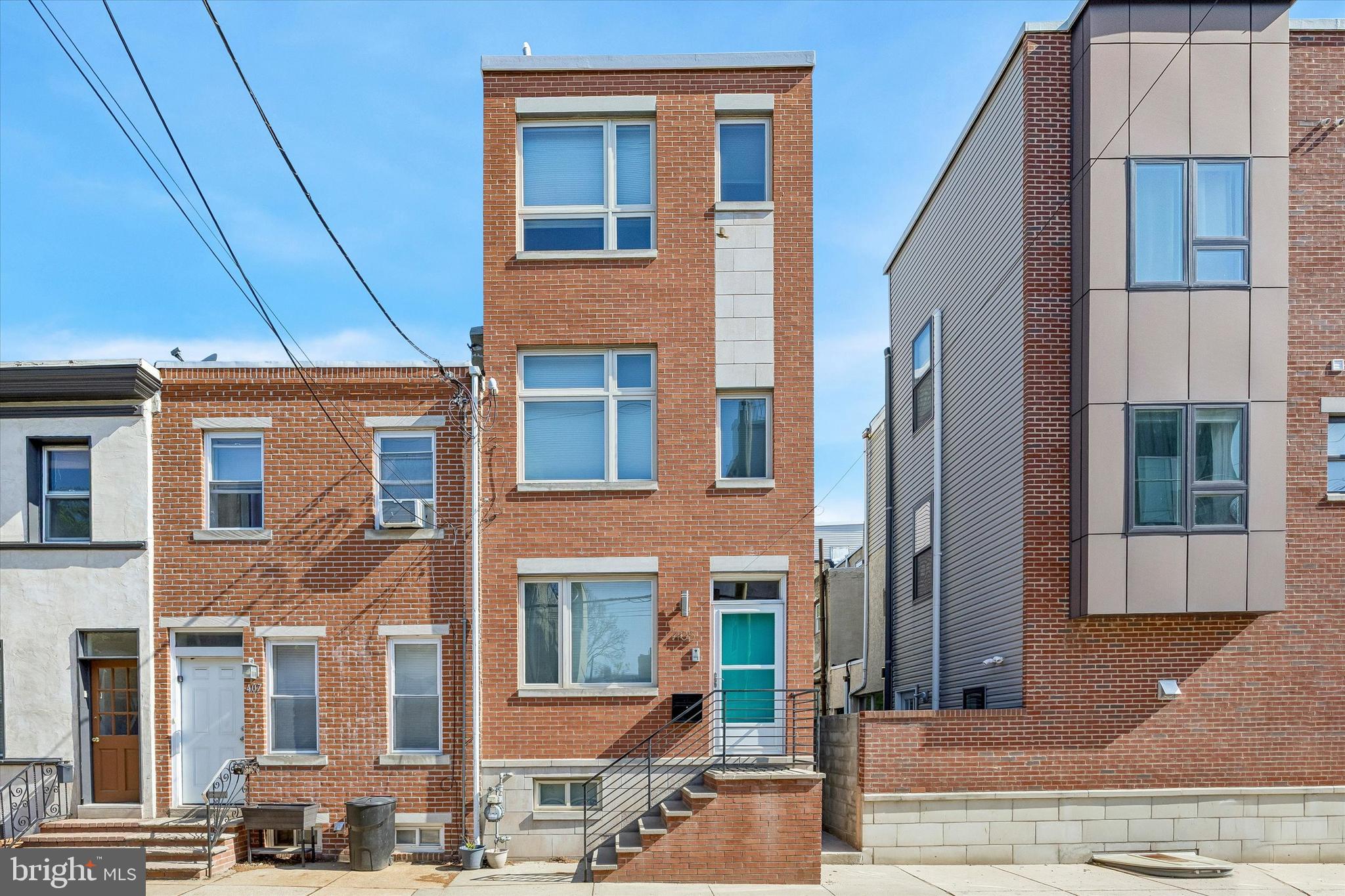 Modern Luxury Meets Classic South Philly Charm. Experience the perfect blend of style, comfort, and convenience in this beautifully crafted contemporary home, ideally situated in the heart of South Philadelphia. Offering 3 bedrooms, 2.5 baths, a finished basement, and large roof deck, this stunning residence delivers the modern city lifestyle today’s buyers are looking for. Step inside to a spacious, light-filled living room featuring hand-stained red oak hardwood floors, recessed lighting, and sophisticated finishes that create an inviting first impression. The designer kitchen is both stylish and functional, showcasing granite countertops, abundant gray cabinetry, a pantry, custom tile backsplash, and stainless steel appliances—perfect for everyday living and effortless entertaining. The second floor offers two generously sized bedrooms with large closets, a convenient hall laundry area, and a beautifully appointed contemporary bathroom featuring a custom vanity, combination tub/shower, and designer tile work. Occupying the entire third floor, the luxurious primary suite is a true private retreat. This serene space features expansive walk-in closets and a spa-inspired bath complete with a frameless glass shower enclosure, upscale fixtures, and custom tile finishes. A wet bar with wine refrigerator adds an extra touch of luxury, while the rear deck with spiral staircase leads to an impressive full fiberglass rooftop deck, where you can unwind or entertain while taking in spectacular Center City skyline views. The fully finished lower level adds exceptional versatility, offering generous closet space and the perfect setting for a media room, home gym, office, playroom, or additional entertaining space. And beyond your front door, South Philly living is at its best. Enjoy neighborhood favorites like Miles Table at Bok and Tamalex, or take a short stroll to the vibrant East Passyunk Avenue corridor, home to more than 150 independent restaurants, lively bars, artisan boutiques, and year-round community events. With Dickinson Square Park, local markets, public transit, and easy access to Center City Philadelphia, this home offers the perfect balance of neighborhood charm and urban accessibility. Stylish, sophisticated, and exceptionally located—this is South Philadelphia living at its finest. Schedule your private showing today.