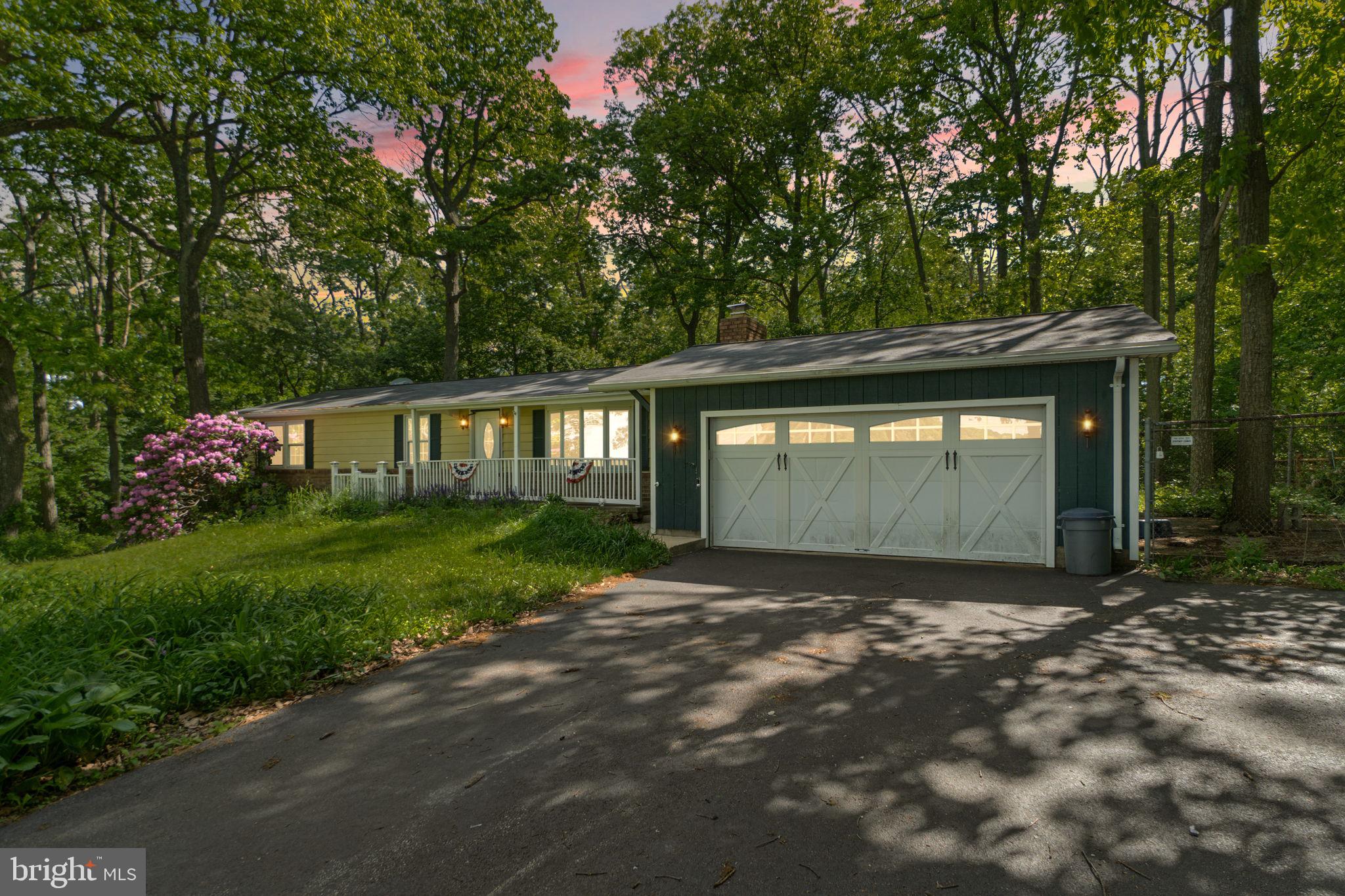 Tucked away in the serene countryside of Manchester, this charming ranch-style home offers the perfect blend of comfort, space, and natural beauty. Situated on just under 1.5 acres, the property is surrounded by mature trees and showcases peaceful, picturesque views in every direction. Inside, you’ll find a spacious and functional layout featuring 3 bedrooms, 1 full bath, and 1 half bath, offering convenient one-level living. The lower level expands your living space with a large recreation/entertaining area, abundant storage, and a dedicated laundry area. There’s also a framed-out space ready for a potential 4th bedroom, home office, or flex space. The attached 2-car garage adds everyday convenience, while the outdoor space is a gardener’s dream with established garden beds ready for the next owner to enjoy. Move-in ready and this home also offers a great opportunity for new owners to bring their own style and updates over time. Enjoy the peaceful, private setting while still being just a short drive to Main Street and local amenities. A wonderful opportunity to own a quiet retreat with room to grow!