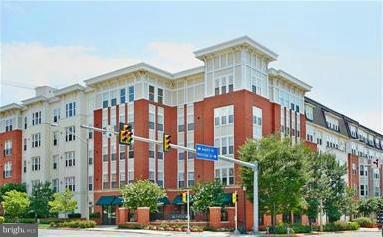 NEW PRICE!!  Absolutely Gorgeous 2BR/2BA ground level condo across from Metro! Granite Counters/SS Appliances,Tile Backsplash, Crown Molding, Open Floor Plan, Neutral Paint, Custom MBR Closet, Storage Unit and 1 Parking Space. All of this in the new Mosaic District with shops, restaurants and nightlife. Amenities include pool, gym, basketball court, party room, pub & concierge. Fantastic Location!