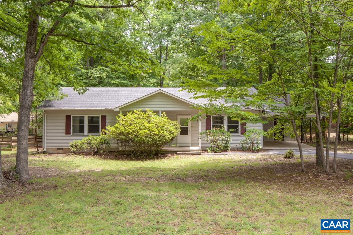 OPEN LAYOUT IN LAKE MONTICELLO - CONVENIENTLY LOCATED OUTSIDE THE MAIN GATE! Welcome to this well-maintained 3-bedroom, 2-bath home offering comfortable one-level living with a bright, open floor plan. The spacious living area flows seamlessly into the kitchen and dining space, creating the perfect setting for everyday living and entertaining. The primary suite features a private full bath, while two additional bedrooms provide flexibility for family, guests, or a home office. Enjoy your morning coffee or unwind after a long day on the screened porch overlooking the backyard. Located in the desirable Lake Monticello community, this home offers the convenience of being just outside the main gate for easy access while still enjoying all the amenities the community has to offer. A wonderful opportunity to enjoy comfortable living in a fantastic location!