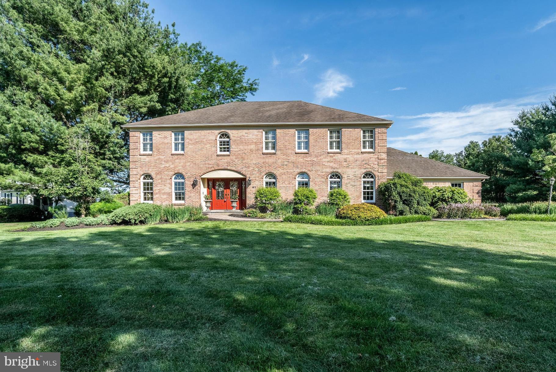 Welcome to 67 Fairfield Lane, a charming 5-bedroom, 3.5-bathroom home nestled on a private 1.3-acre lot in the highly sought-after Fairfields community of Chester Springs and located within the award-winning Downingtown Area School District. Offering the perfect blend of elegance, comfort, and outdoor living, this exceptional property features a private in-ground pool, expansive outdoor entertaining spaces, and a thoughtfully designed floor plan. Step inside to a grand two-story vaulted foyer that immediately sets the tone for the home. Gorgeous hardwood floors flow throughout much of the main level. To the left, the formal living room offers a full wall of custom built-in shelving, creating the perfect space for a library, sitting room, or conversation area. To the right, the formal dining room is beautifully appointed with chair rail molding and a chandelier, making it the ideal setting for holiday gatherings and special occasions. At the heart of the home, the inviting family room features a cozy fireplace, picturesque views of the backyard, and a wet bar with countertop seating—perfect for entertaining guests. The spacious eat-in kitchen is designed with both function and style in mind, boasting a large two-level center island with seating and storage, abundant cabinetry, and generous prep space. The adjoining eating area is warmed by a striking floor-to-ceiling brick fireplace and offers direct access to the expansive rear deck overlooking the pool and backyard oasis. A private home office with a full wall of built-in shelving provides an ideal work-from-home setup, while a convenient powder room completes the main level. Upstairs, the spacious primary suite serves as a peaceful retreat, filled with natural light and featuring a comfortable sitting area and walk-in closet. The spa-inspired primary bathroom offers a dedicated vanity area, skylight, soaking tub, and tiled glass-enclosed shower. Three additional generously sized bedrooms share easy access to an updated full hall bathroom. The fully finished lower level offers endless possibilities, providing valuable additional living space for an entertaining area, home gym, playroom, or guest retreat. A fifth bedroom and full bathroom make this level ideal for guests or extended family. The laundry area is also conveniently located on this floor, while a large unfinished storage space ensures room for all your seasonal items and belongings. Outside, discover your own private backyard paradise. Facing east, you'll enjoy the warmth of the morning sun and comfortable afternoon shade. The expansive deck is the perfect setting for summer barbecues, outdoor dining, or simply unwinding after a long day. Relax beneath the pergola, cool off with a swim in the private in-ground pool, and enjoy the large fenced yard that provides plenty of space for children, pets, and outdoor activities. Tucked away on a quiet cul-de-sac, this remarkable home offers peaceful community living while remaining just minutes from local shopping, dining, parks, and major commuting routes, including the Pennsylvania Turnpike. A rare opportunity to own a private retreat in one of Chester Springs' most desirable neighborhoods. Welcome home!