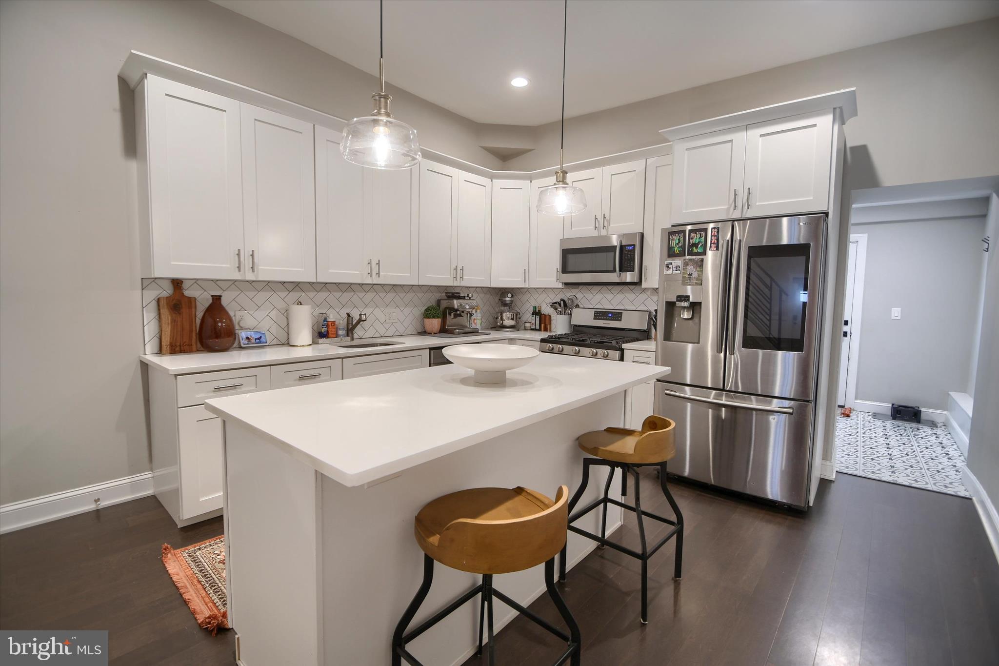 Just Steps from Main Street in Manayunk, this home blends modern style with space & flexibility young professionals are looking for. Main level features high ceilings, hardwood floors, and an expanded open-concept living area—perfect for hosting friends or relaxing after work. You’ll also appreciate the remaining 4 years of tax abatement and a large basement with plenty of storage..

Updated kitchen is designed for both function & style, with a large island, plenty of cabinetry & space for casual dining or entertaining. A convenient half bath, in-unit laundry, & a sleek wet bar add to the lifestyle appeal, while the backyard offers a great spot for weekend hangouts or outdoor dining. Smart renovations have maximized space—including an expanded living room thanks to alleyway usage—giving the home a more open, comfortable feel. Primary suite is a true retreat, complete with a walk-in closet featuring sliding barn doors and a modern bathroom, double sinks & a spacious walk-in shower. Additional bedrooms are bright, roomy, and ideal for guests, a home office, or roommates.

All of this in a prime location, just steps from Manayunk’s vibrant dining, shopping, and nightlife scene, with easy access to Center City Philadelphia—making it an ideal home base for work and play.