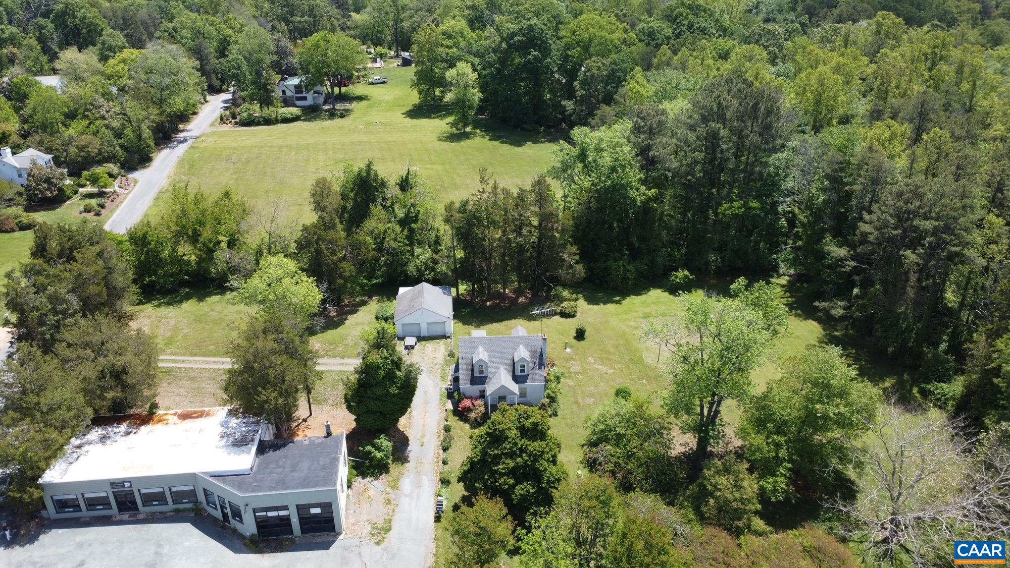 Rare Keswick opportunity you simply cannot replicate. This 3.79-acre property sits on a prime corner and includes a grandfathered commercial building with a special use permit that conveys with the building; making it one of the only commercially viable buildings in the area. Whether you envision a boutique studio, workshop, tasting room, or rental income, the commercial unit is vacant and ready for an owner-occupant or tenant from day one. The residential home features a generous yard plus additional wooded acreage, offering ample room to expand the existing structure or build new. Privacy, flexibility, and upside all on one parcel. Located minutes from Southwest Mountain and the storied estates of Merrie Mill, this is the heart of Keswick countryside at its finest. Properties like this don't come along twice.,Wood Cabinets