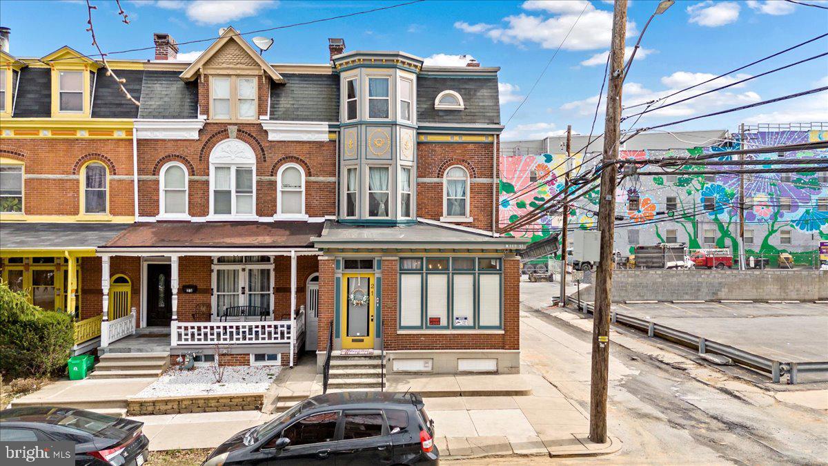 CLEAR CERTIFICATE OF OCCUPANCY PROVIDED - Welcome to 21 N 11th Street in Allentown, a beautifully maintained former 3 unit Victorian end-of-row home in the Old Allentown Historic District. This spacious 5-bed, 3-bath residence spans over 2,700 sq ft and features hardwood floors, high ceilings, and historic wood-framed windows. The first floor includes a sunroom, living room, family room, dining room, full bath, an updated kitchen with stainless steel appliances, a farmhouse-style sink, and open shelving. Each level has its full bath, providing flexibility and privacy—ideal for larger households, multi-generational living, or working from home. The second floor offers three generously sized bedrooms, an office or walk-in closet, and a full bath with classic tile finishes. The third floor adds two more bedrooms, another full bath, a spacious recreation room with stained glass accents, and a former kitchen with utility sink and cabinetry, offering additional storage or creative use. Outdoor amenities include a fenced-in yard perfect for gardening or relaxation, a front porch, two balconies with beautiful city views, and a detached 1-car garage with an electric opener. This corner lot property also includes three electric meters plus an owner’s meter—an excellent option for shared utility management or future adaptability. Located in a vibrant downtown neighborhood near parks, shopping, dining, and local schools. This home is served by public water and sewer, gas heating, and window A/C units. Furniture is negotiable.