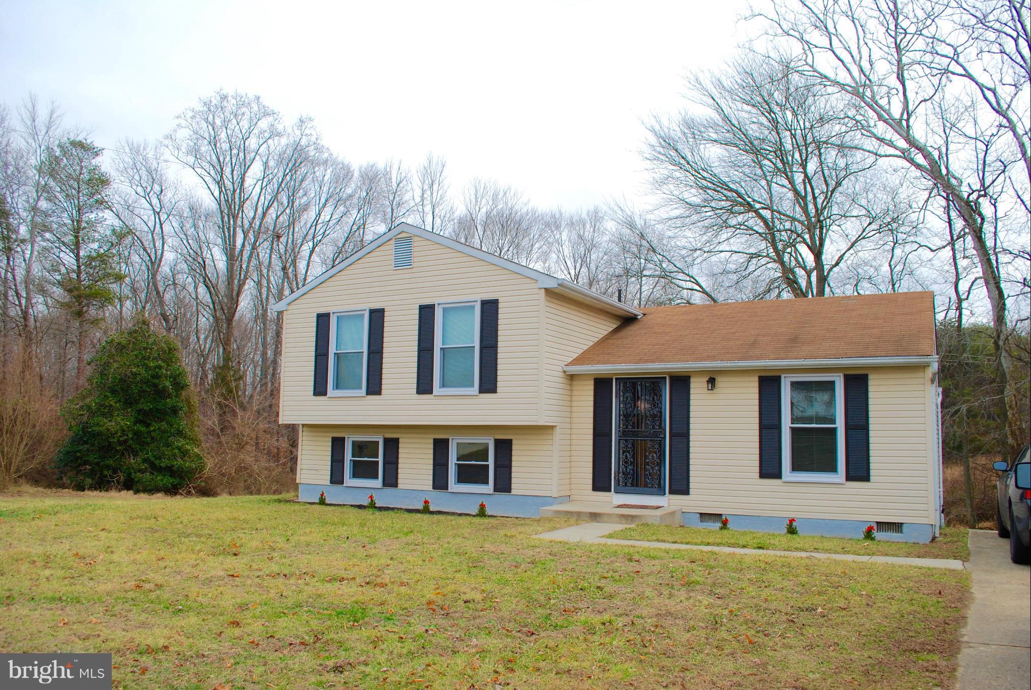 SUMMER IS JUST AROUND THE CORNER. BE READY TO COOKOUT ON THIS  SPRAWLING  DECK/PATIO. (DECK PERMITTED FOR  SUN ROOM ADDITION) ENJOY BRAND NEW  ROOF,SS APPLIANCES,CARPET,PAINT,FLOORS,COUNTER TOPS,TOILETS,OVERHEAD LIGHTING, AND DOOR KNOBS. LL HAS BUILT IN BOOKSHELVES, WOOD STOVE W/BLOWER, SEPARATE LAUNDRY/ROUGH IN FOR FUTURE BATH.