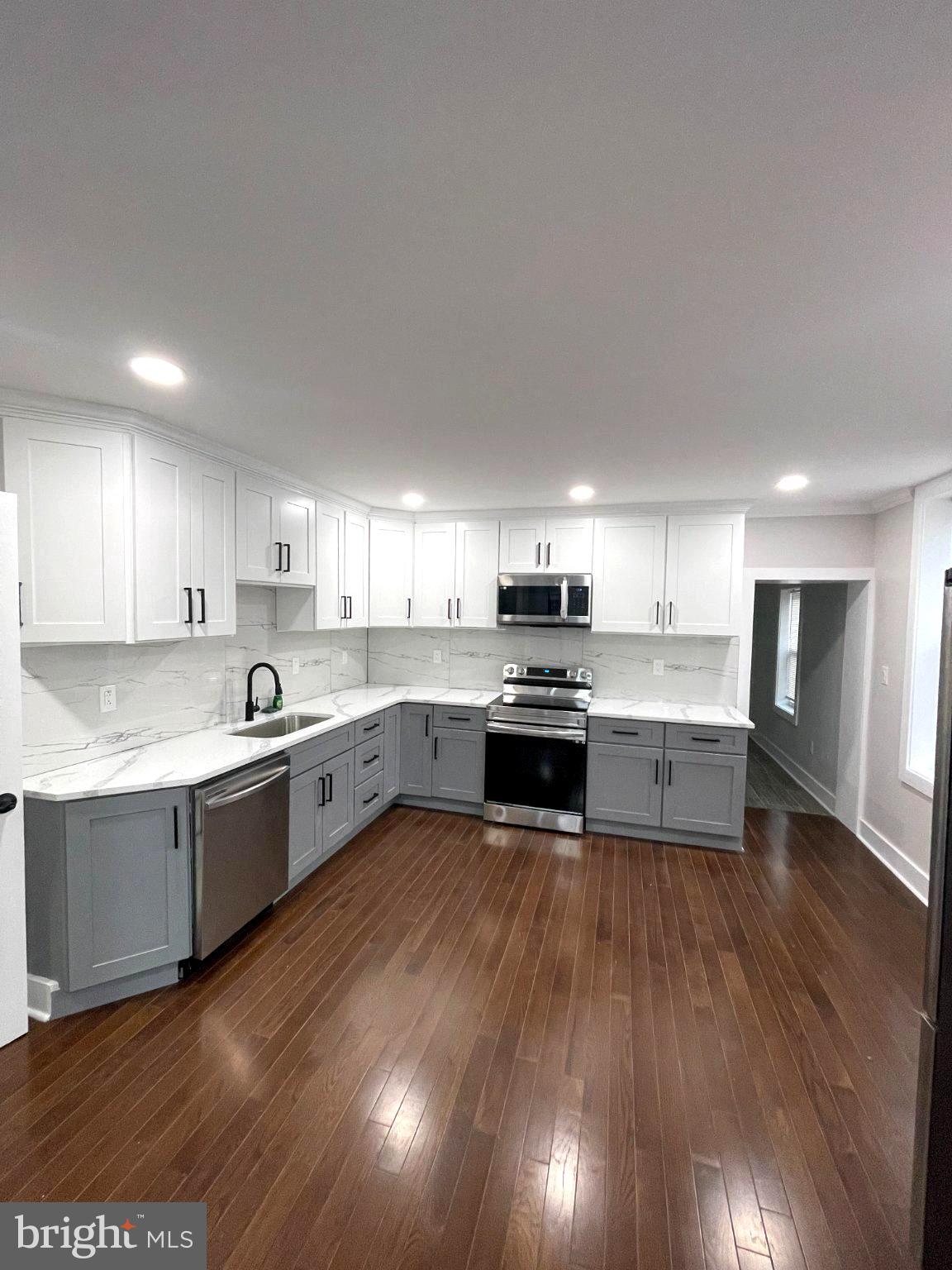 Discover a beautifully renovated end-of-row townhouse in the heart of Port Richmond, where classic charm meets modern luxury. This exquisite home, originally built in 1925 and fully renovated in 2025, boasts 1,700 sq. ft. of elegant living space. Step inside to find a seamless blend of hardwood and ceramic tile flooring, creating a warm and inviting atmosphere throughout. The gourmet kitchen features high-end stainless steel appliances, including an ENERGY STAR dishwasher, ensuring both style and efficiency. Enjoy cozy evenings by the electric fireplace in the spacious living area, perfect for relaxation. With three generous bedrooms and 2.5 luxurious bathrooms, this home offers ample space for comfort and privacy. The fully finished basement adds versatility, ideal for a home office or entertainment space. Experience the exclusive lifestyle this property offers, with modern conveniences and timeless elegance, all within a vibrant community. Embrace the perfect blend of luxury and comfort in your new home. One of the owners is licensed in PA.