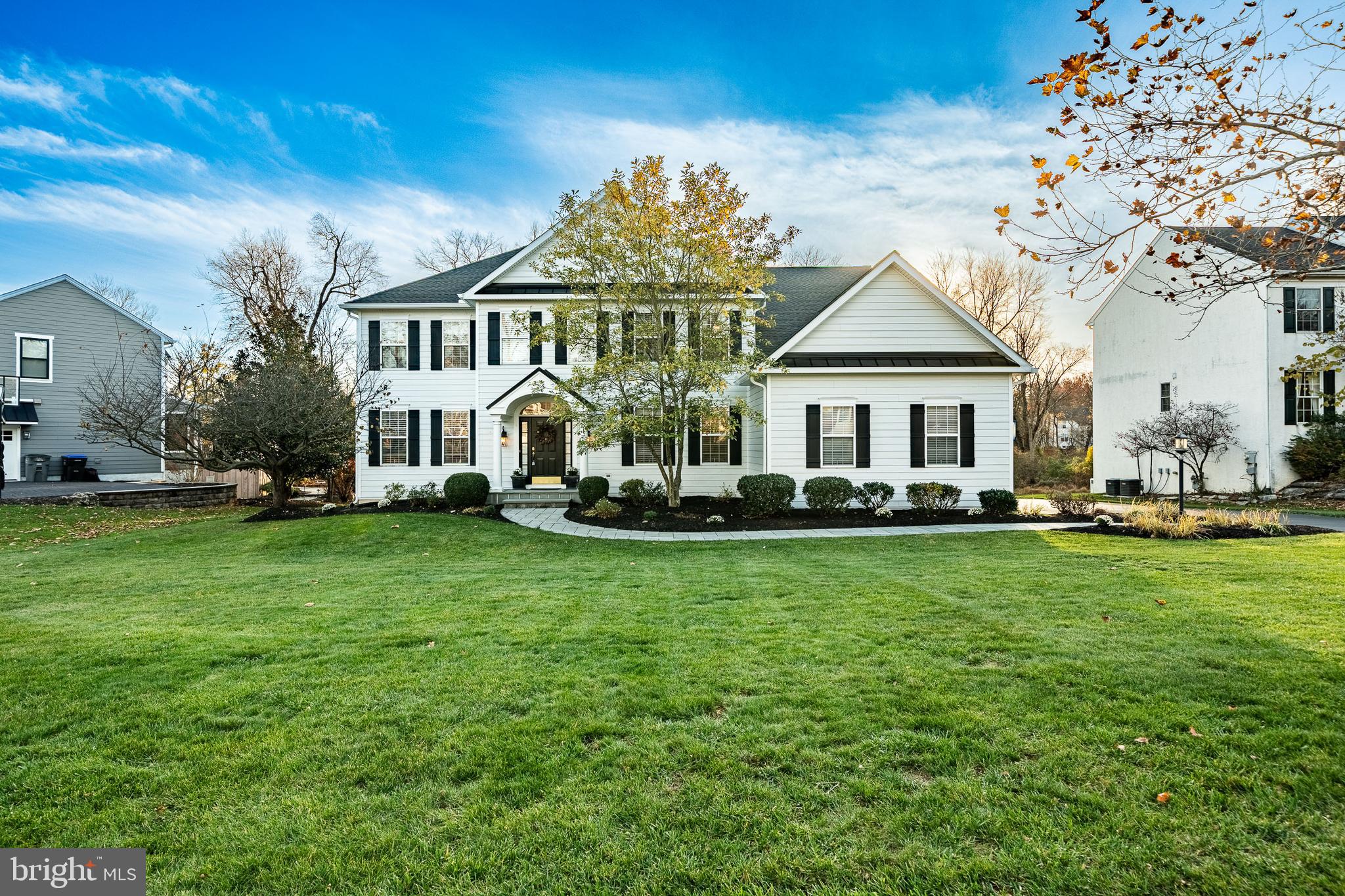 Experience the unparalleled flow and sophisticated design of this stunning residence at 309 Creek Crossing Ln, situated on a serene lot that backs to a private creek and lush mature landscaping. —it’s a lifestyle. Elegant, inviting, and unforgettable with 5 Bedrooms & 5.5 Baths!  This property exemplifies the best of suburban luxury, seamlessly blending elegant formal spaces with an inviting, open-concept main floor—the perfect setting for family gatherings and grand entertaining. A pristine paver walkway leads you to a magnificent two-story foyer, anchored by an impressive arching staircase and adorned with classic wainscotting and gleaming hardwood flooring. Behind elegant French doors, a dedicated entryway office features built-in bookcases, providing a private workspace. The main floor encourages effortless movement with a formal dining room featuring a stunning overhead chandelier, wainscotting, and crown molding, bathed in abundant natural light. The adjacent front family room offers a quiet retreat. At the heart of the home is the expansive open-concept main space, where the gourmet eat-in kitchen overlooks the spacious living room. The chef's kitchen boasts an off white cabinetry, granite countertops, a large pantry, and an arching island with seating—perfect for casual dining. The integrated design includes built-in wall ovens and a separate cooktop. A sun-drenched living room is warmed by a beautiful granite fireplace and provides a convenient second staircase to the upper level. A bright sunroom with skylights sits just off the kitchen, offering exterior sliders that lead directly to the patio and the expansive, maintenance-free deck. Upstairs, five spacious bedrooms offer privacy and luxury. The Primary Suite is a tranquil escape, featuring a vaulted ceiling, a separate sitting area, and 2 oversized walk-in closet. Immerse yourself in the luxurious Primary Bathroom, which boasts separate vanities, a deep soaking tub, and a separate walk-in shower—a true spa-like retreat. The second floor also includes TWO desirable Princess Suites, a convenient Jack & Jill bathroom connecting two additional bedrooms. The home’s impressive footprint extends to the finished basement, designed with multiple zones for flexible uses, from a home gym to a media room. Complete with a full bathroom (tile flooring, tile shower), the lower level offers both exterior sliders and a dedicated walk-up exit to the backyard. Practical features include a centrally located hall powder room, a large private laundry room with a wash sink and overhead storage, and a three-car garage. Savor the peace of the serene backyard from the large deck, enjoying the tranquility of the lush landscape and private creek. This home has been meticulously maintained with major recent upgrades, including: New Roof and Skylights (2023) – 50-year transferable warranty, James Hardie Siding (2022), Trex Deck with Lighting (2023), Dual-Zoned HVAC Systems with new furnaces and A/C units (2022 & 2025), Hot Water Heater (2022, 73 gallons), Whole-House Generac Generator (2020), Insulated Garage Doors and Mechanisms (2022), New Gutters (2025), Upgraded Exterior Lighting throughout. Outdoors, enjoy the lush lawn, landscaped beds, and semi-private wooded setting that borders a gentle creek—a peaceful and picturesque backdrop for relaxing or entertaining. Homeowners especially love the tree-lined streets and community green space, the single-entry neighborhood layout, the quality of the lot and eastern front exposure, the spacious flow for entertaining, large bedrooms, ample basement storage, and easy access to major routes, shopping, dining, and top-rated public and private schools. Situated in the sought-after Pickering Meadows community, known for its quiet atmosphere and green space, and located in the Award-winning Downingtown East/STEM School District.  Close proximity to  Malvern, Downingtown, Exton, and Phoenixville, and within 45 minutes of the airport
