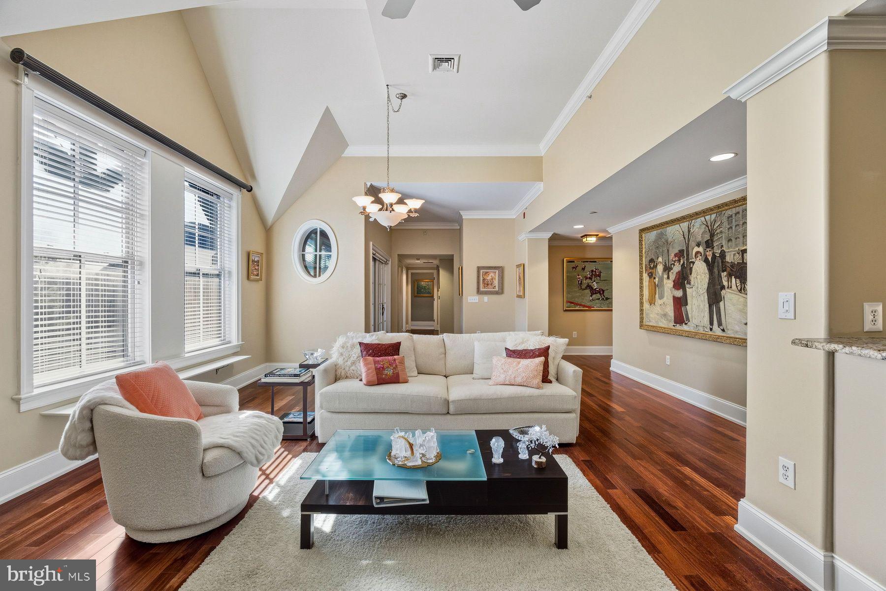 Experience refined Main Line living in this exceptional penthouse residence at Ardleigh, an exclusive boutique condominium community of just ten luxury homes in the heart of Ardmore.
Inside, soaring 14-foot vaulted ceilings create a dramatic sense of space throughout the main living and dining areas, where rich hardwood floors, abundant natural light, and a gas fireplace set the stage for effortless everyday living and entertaining. The gourmet kitchen is thoughtfully designed with a 36-inch Viking gas range and hood, stainless steel appliances, granite countertops, tile backsplash, and a generous center island with sink and dishwasher. Sliding glass doors open to a private covered balcony, extending the living space outdoors.
The spacious primary suite serves as a peaceful retreat, offering room for a sitting area or home office, an expansive custom walk-in closet, and a luxurious marble-appointed bath featuring dual vanities, a seamless glass shower, and an oversized Kallista soaking tub. A second bedroom enjoys easy access to a beautifully finished full bath with marble basketweave flooring and marble-surround tub/shower. A large laundry room with built-in cabinetry and utility sink, a stylish powder room, and an oversized walk-in coat closet add everyday functionality.
Completing the offering are two dedicated underground parking spaces and a private storage unit, providing the ultimate in comfort, convenience, and low-maintenance luxury.
Perfectly positioned within walking distance of the Ardmore Farmers Market, Trader Joe's, the area's renowned restaurants and boutiques, and the Ardmore Train Station. With Center City Philadelphia less than 30 minutes away, this coveted location offers an unmatched blend of walkability, accessibility, and sophisticated Main Line living.