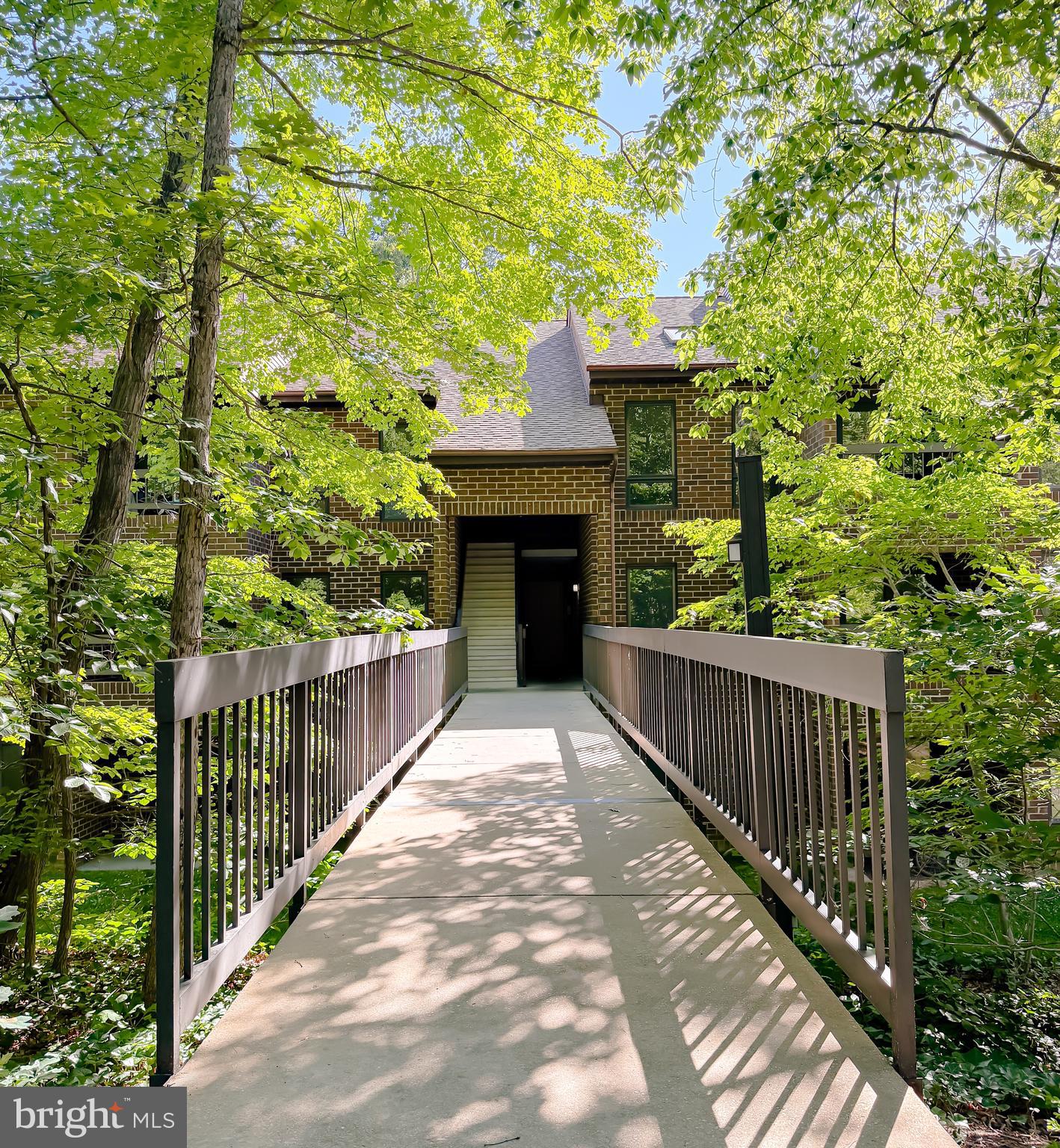 BRIDGE LEVEL access--car to front door, no steps in between! Ideally located, with the perfect combination of convenience and affordability, this condo is a much see,  Thoughtful enhancements include newer LVP flooring throughout much of the main level and newer carpet in both bedrooms.  The primary bedroom has a generous walk-in closet and attached half bath. The second bedroom is across the hall from the full bathroom and separate laundry room.  A private balcony offers the ideal spot to sip morning coffee or unwind after a full day. Conveniently located near multiple shopping centers, restaurants, a movie theatre and PAX this unit creates a great opportunity to own your own home, close to all the conveniences yet tucked away in a quiet location. Water, sewer, trash and snow removal are included in the HOA. Pool memberships are available for purchase. Bridge level units are sought after so don't sleep on this great opportunity!