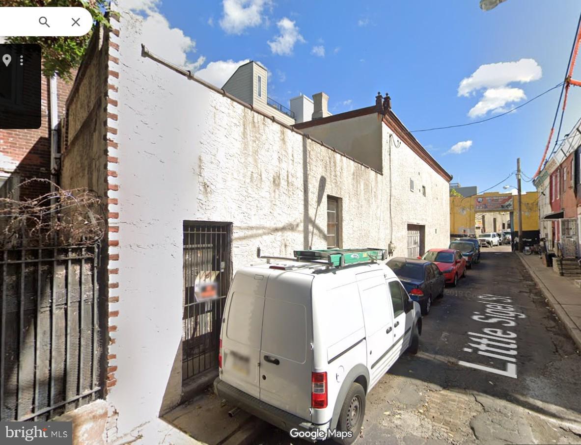 Also known as 435 Little Sigel Street.  Great opportunity in a popular neighborhood.  This 2 story structure  has been used as a storage, garage with office space on ground level and with an upstairs for partial upper level storage.  Small private street for a savvy investor.
