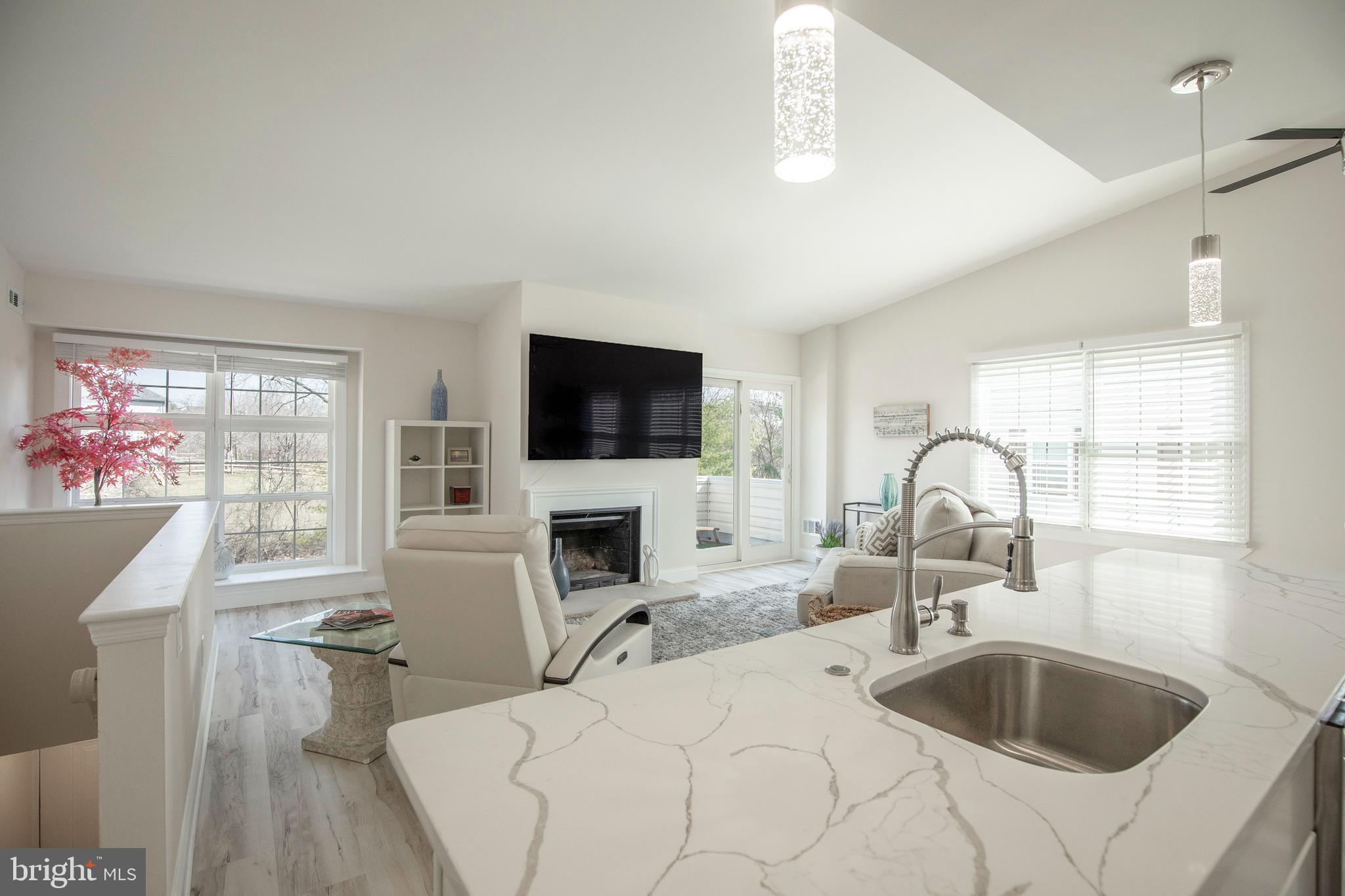 Introducing a truly one-of-a-kind, top-floor end unit in the coveted Yorkshire Meadows
community—this home redefines luxury living in New Hope. Exquisitely remodeled with
impeccable attention to detail, this condo offers a sophisticated blend of modern
updates, thoughtful design, and a prime location just moments from downtown New
Hope. Every inch of this space has been carefully crafted to deliver an elevated living
experience. Step inside to discover sleek new flooring that flows seamlessly throughout,
setting the stage for the open and airy layout. The fully remodeled kitchen is a
showstopper, featuring stunning quartz countertops, a classic subway tile backsplash,
and stainless-steel appliances that create a perfect balance of style and function. The
island, with its convenient overhang, invites casual dining and effortless entertaining.
The primary ensuite bedroom boasts a newly installed tray ceiling with lighting, a ceiling
fan, and a premium walk-in closet system with shelving and drawers. The second
bedroom is generously sized, also featuring an organizational closet system. Both
bathrooms have been completely renovated, with new vanities, toilets, a tub, a stall
shower with seamless glass enclosures, and custom tile throughout. New ceiling fans
have been installed in both bedrooms and the dining room for added comfort. This
home is bathed in natural light thanks to large windows and sliding doors leading to a
private patio with serene views of mature trees. Additional high-end upgrades include
new ceiling fans, an updated attic vent fan, utility closet shelving, new light fixtures, and
state-of-the-art plumbing with PEX piping and new shut-off valves. The hot water heater
has been repositioned to optimize space and allow side-by-side placement for the
included washer and dryer. With an outdoor storage area and a community that covers
lawn care, exterior maintenance, trash, and snow removal, this stunning condo
combines luxury, convenience, and the perfect New Hope location. A rare opportunity to
own a home with such exceptional finishes—ready for you to move in and enjoy the
best of New Hope living!