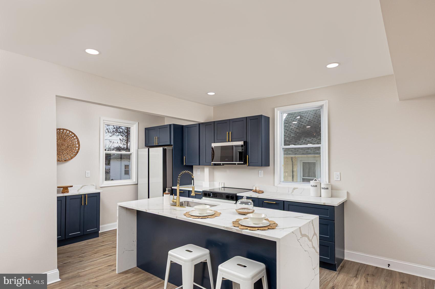 Brand new renovation! *** Large inviting front porch *** New roof *** New HVAC *** Bright and airy designer kitchen *** High end appliances *** Quartz counters *** Finished basement with second full bath *** Spacious rooms *** Convenient location close to everything *** Photos coming soon!